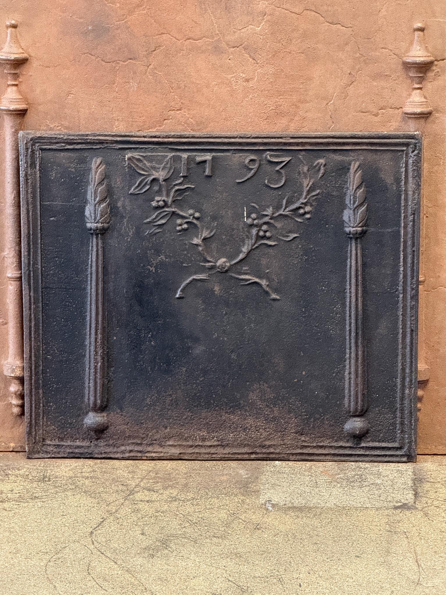French neoclassical Period fireback with two decorated pillars, two olive branches and the date of production 1793.

The fireback is made of cast iron. It is in good condition and does not have cracks.