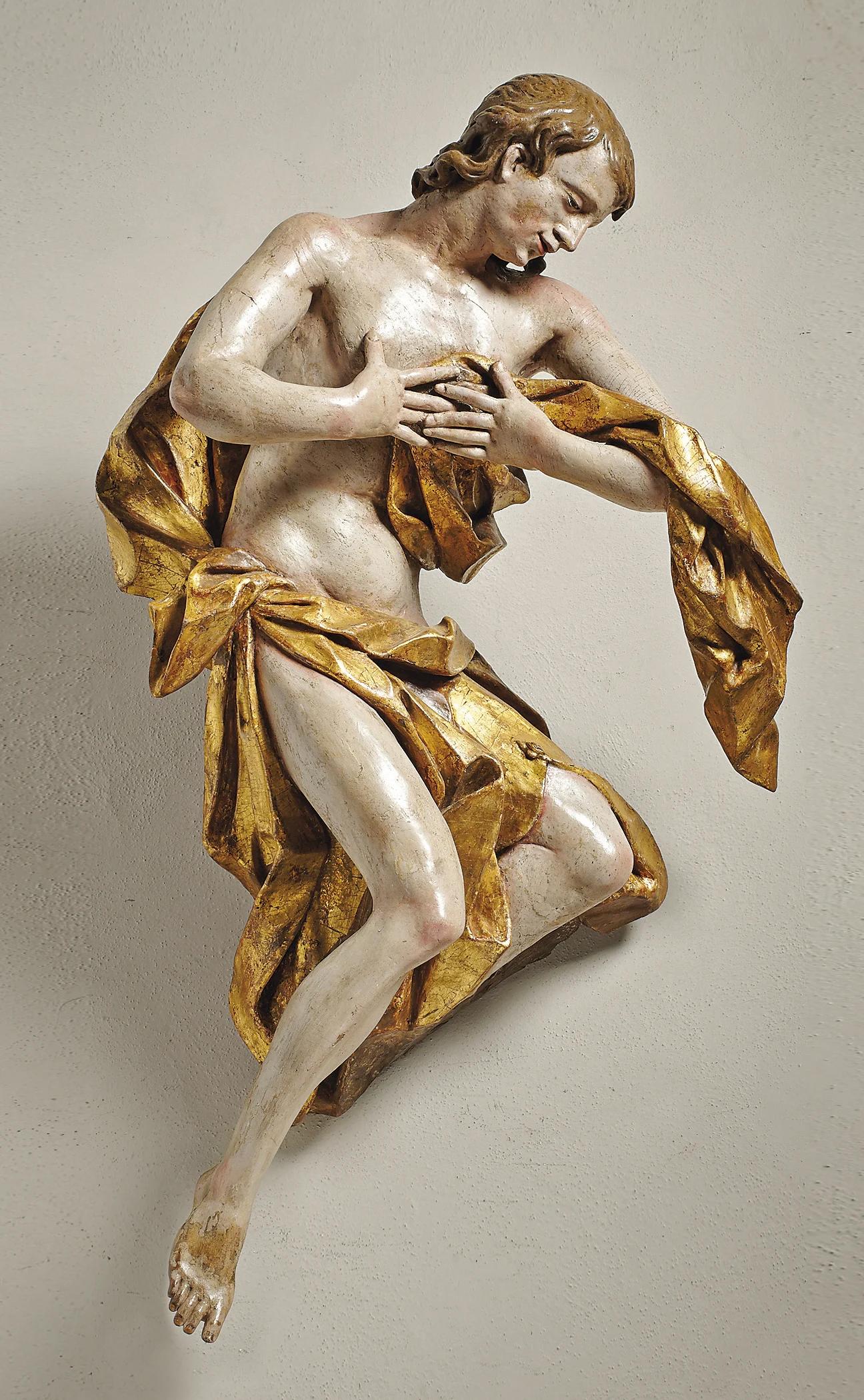 A large polychrome and gilt limewood sculpture of an Angel in the Manner of Franz Ignaz Gunther, ca. 1770, Munich (Bavaria)

Approximate size: 107 cm (h)

The present sculpture probably once formed part of the upper section of a tall church altar in