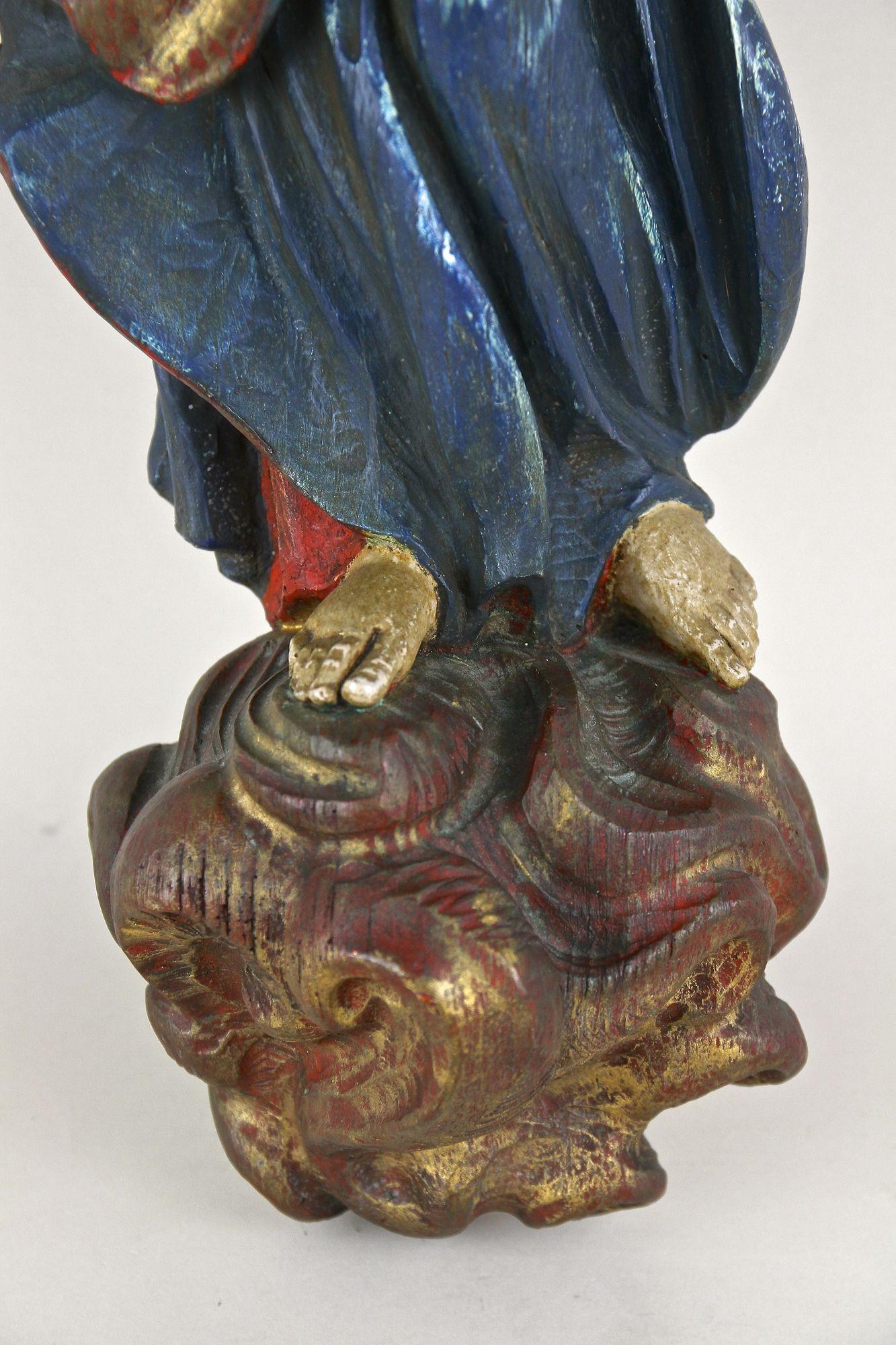 Exceptionally beautiful, polychromed figural baroque wall sculpture from the period around 1760 in Austria. By showing real craftsmanship, this fantastic looking, sacred wall sculpture was artfully hand carved out of a solid piece of basswood and