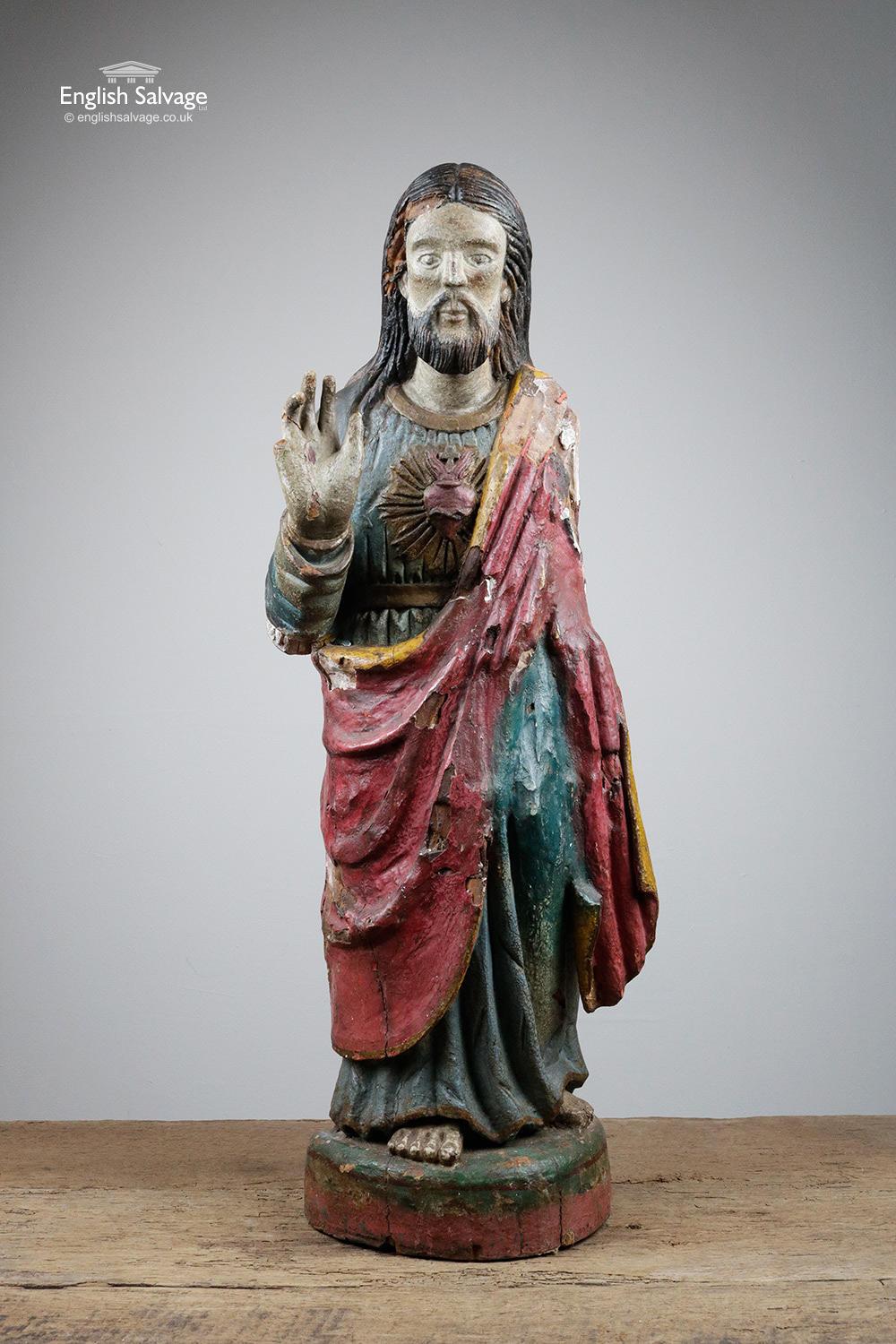 Antique hand carved wooden polychrome Sacred Heart Jesus figure, dating from circa 17-18th century. Some loss to the back of the base, the right shoulder, the left hand side of the face plus one finger is missing and another needs reattaching.