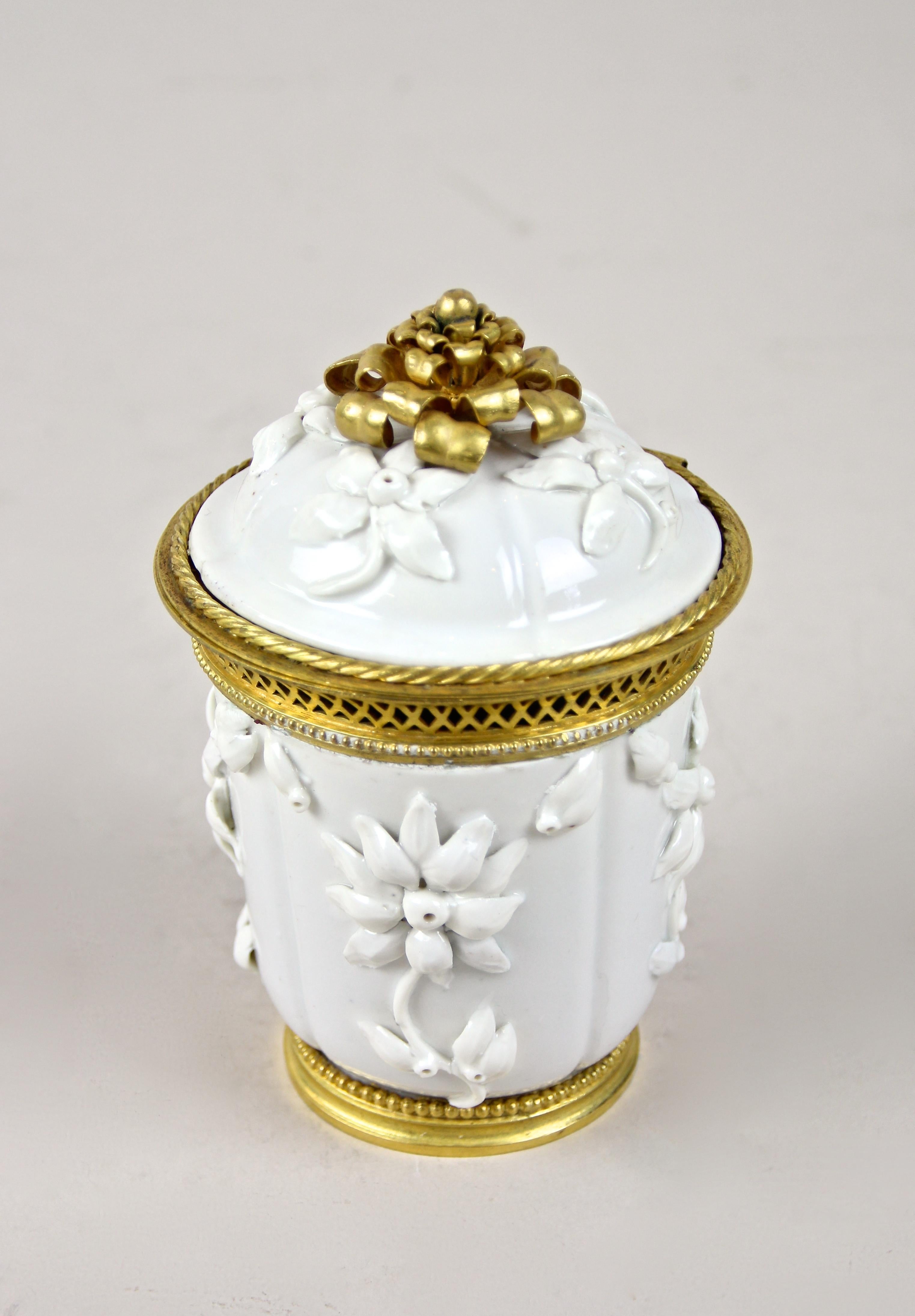 Extraordinary 18th century porcelain jar by Saint Cloud out of France. Artfully processed, circa 1730, this rare porcelain jar with hinged lid and firegilt elements was designed as a noble Potpourri box. Finely scented petals were filled in and