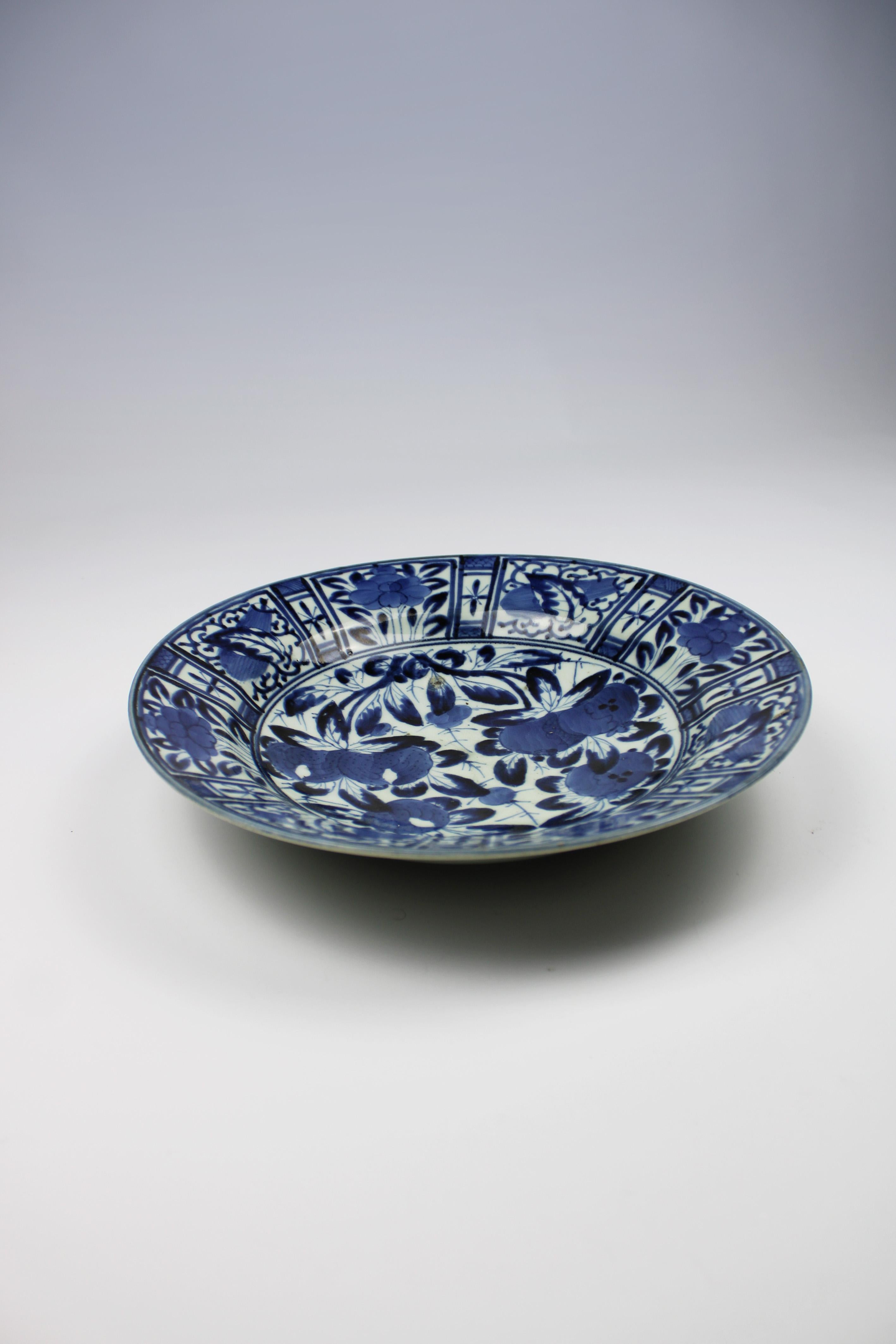 Introducing a captivating relic from the 17th century: a Kraak porcelain plate from Japan's Arita city, dating back to the illustrious Edo Period. This remarkable piece features exquisite hand-painted fruit motifs in classic blue and white,