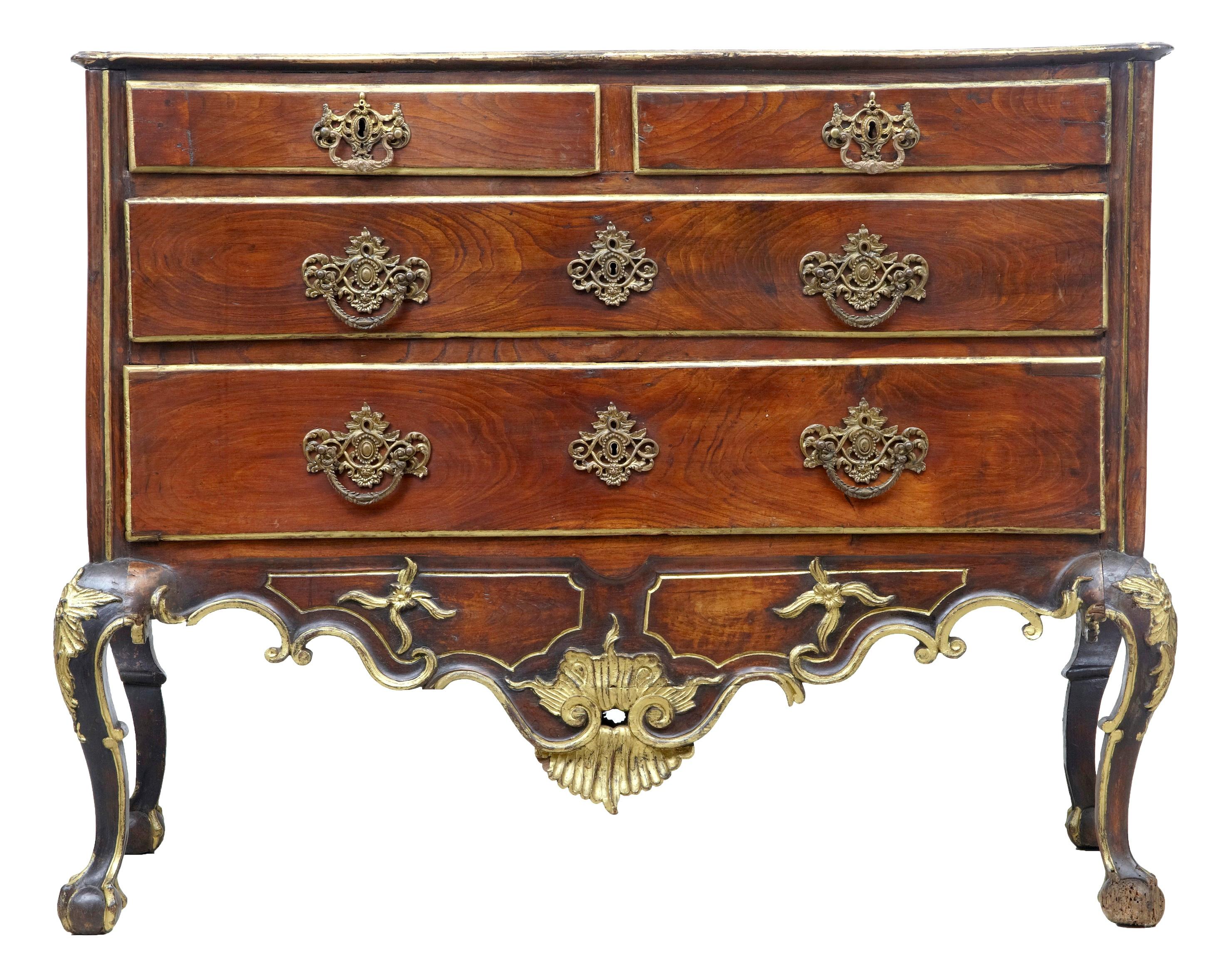 Excellent quality Dom Jose period commode, circa 1770.
Two short over two long drawers.
Profusely carved and detailed with parcel-gilt decoration, shells to the front frieze and sides.
Standing on cabriole legs and ball and claw feet.

Minor