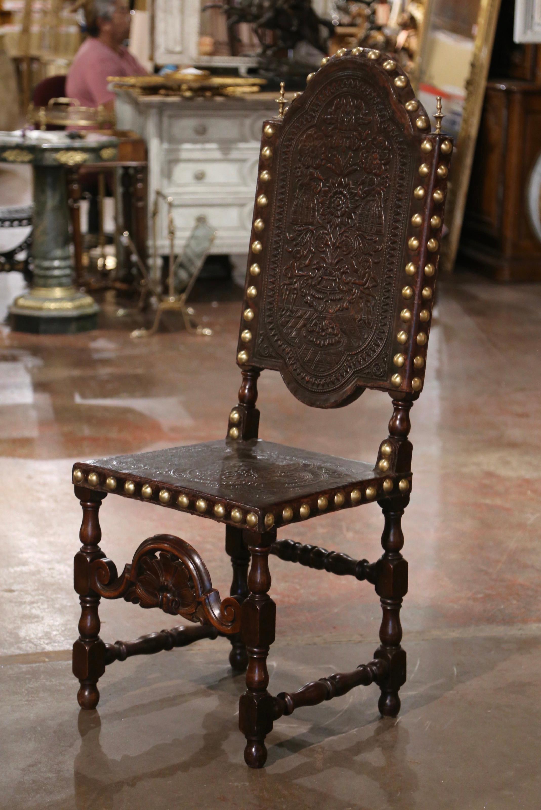Decorate an entry or office with this tall antique Renaissance chair. Crafted in Portugal, circa 1760, the stately chair sits on turned legs over a stretcher decorated with a carved shell motif. It features a wide and deep seat and the tall arched