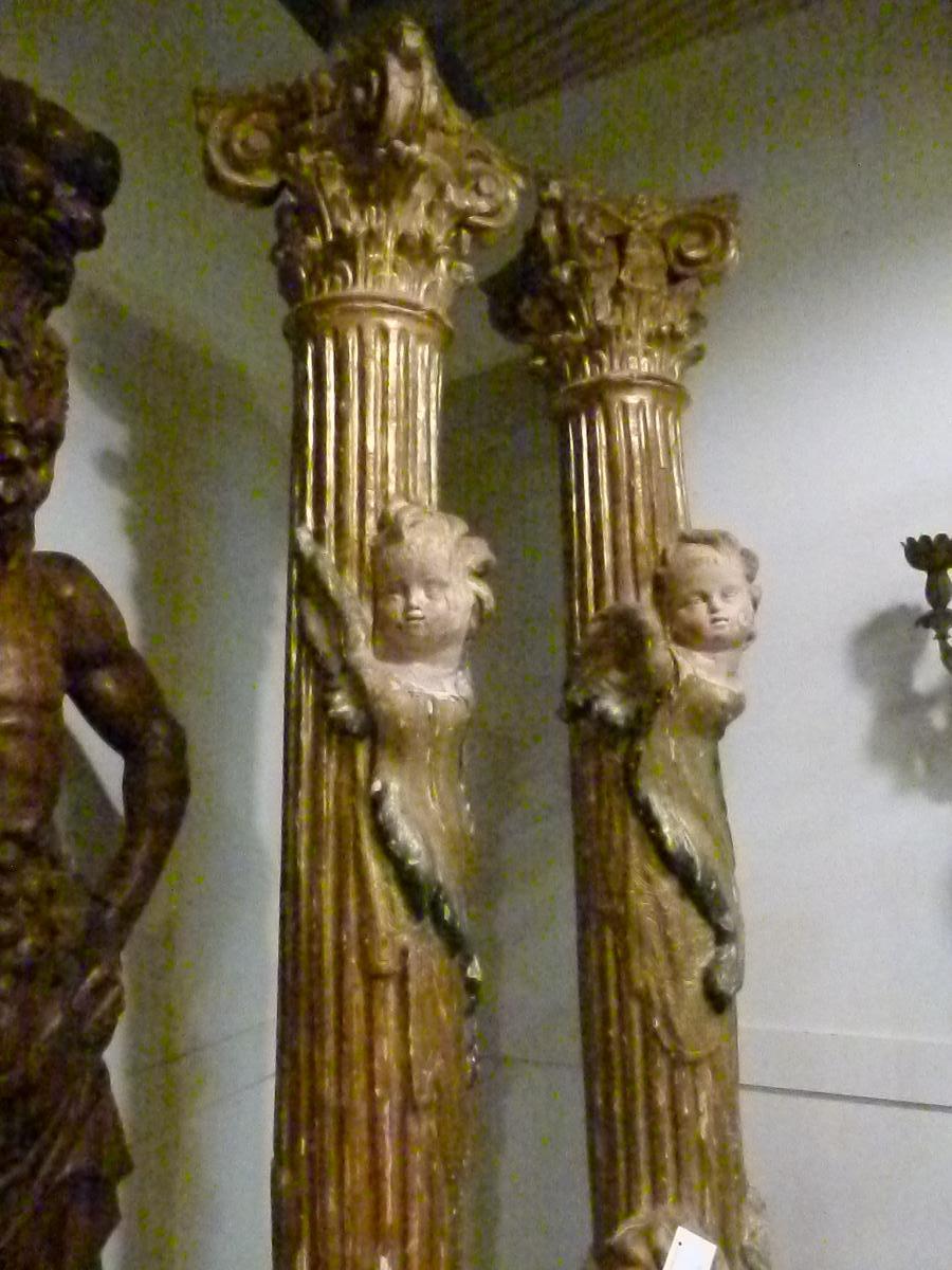 Pair of hand carved polychrome wooden columns, with gold leaf decorations.
Formed with angel’s sculptures and a capital in a classical Greek style.