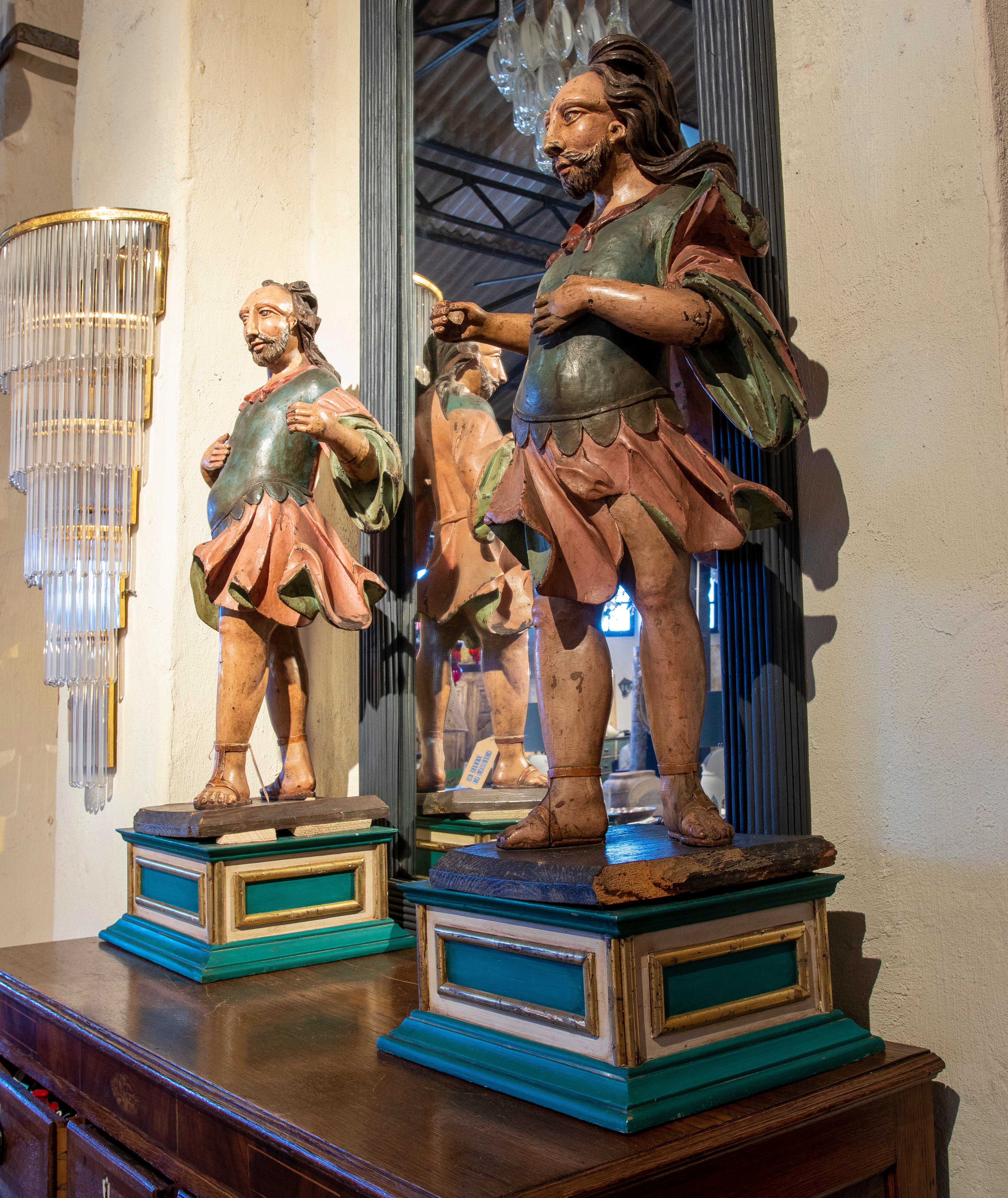 18th century portuguese pair of polychrome sculptures of warriors on pedestal.