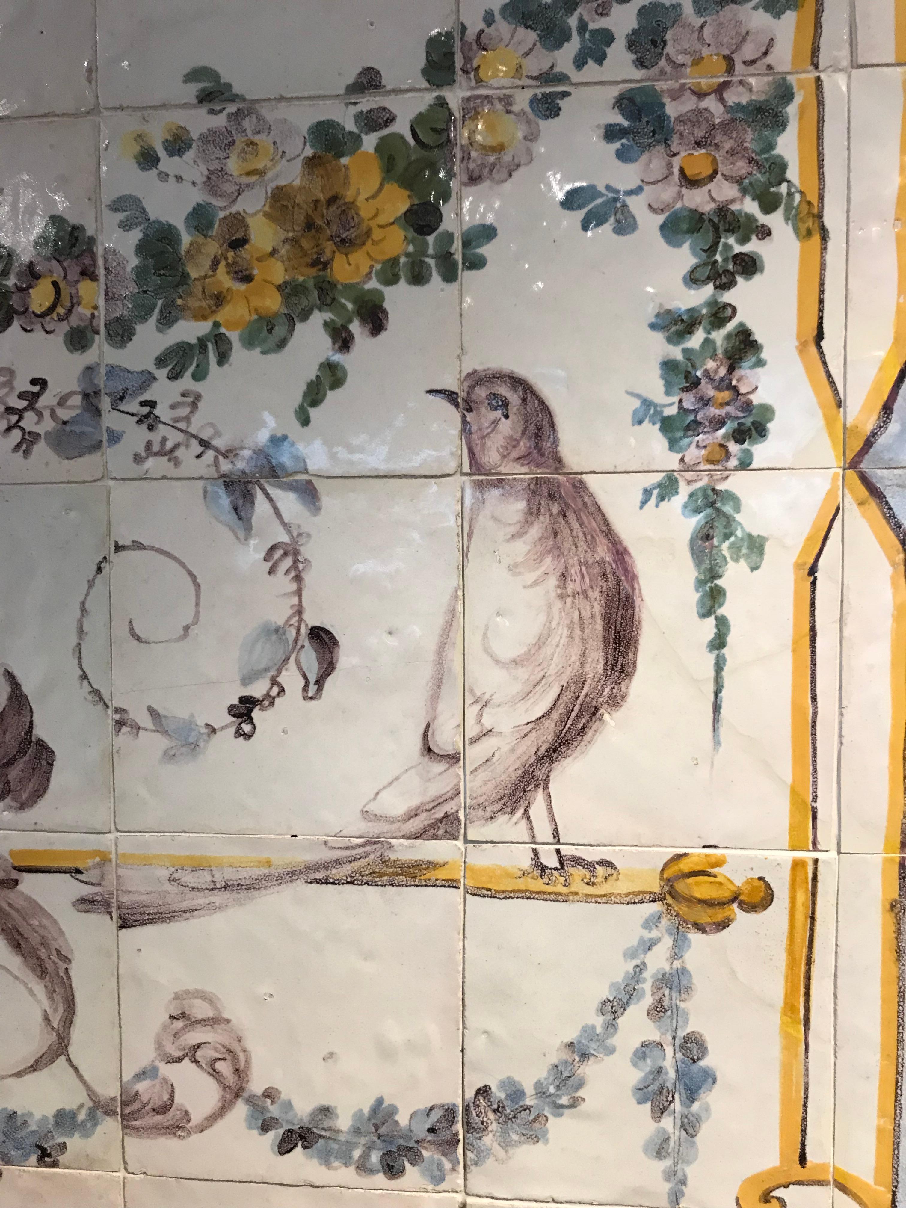 Panel of polychrome tiles of the period of D.Maria I, late eighteenth century. Represents a flowerpot and two birds in the neoclassical style of the time. The craftsmen have recovered the polychrome of the XVII and dropped the blue on white very