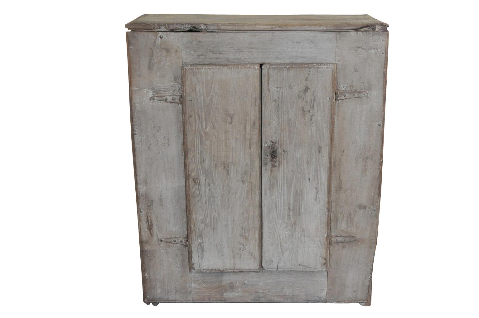 A very charming and primitive cupboard from the Catalan region of Spain. Soundly constructed from painted oak with an fabulous worn patina.