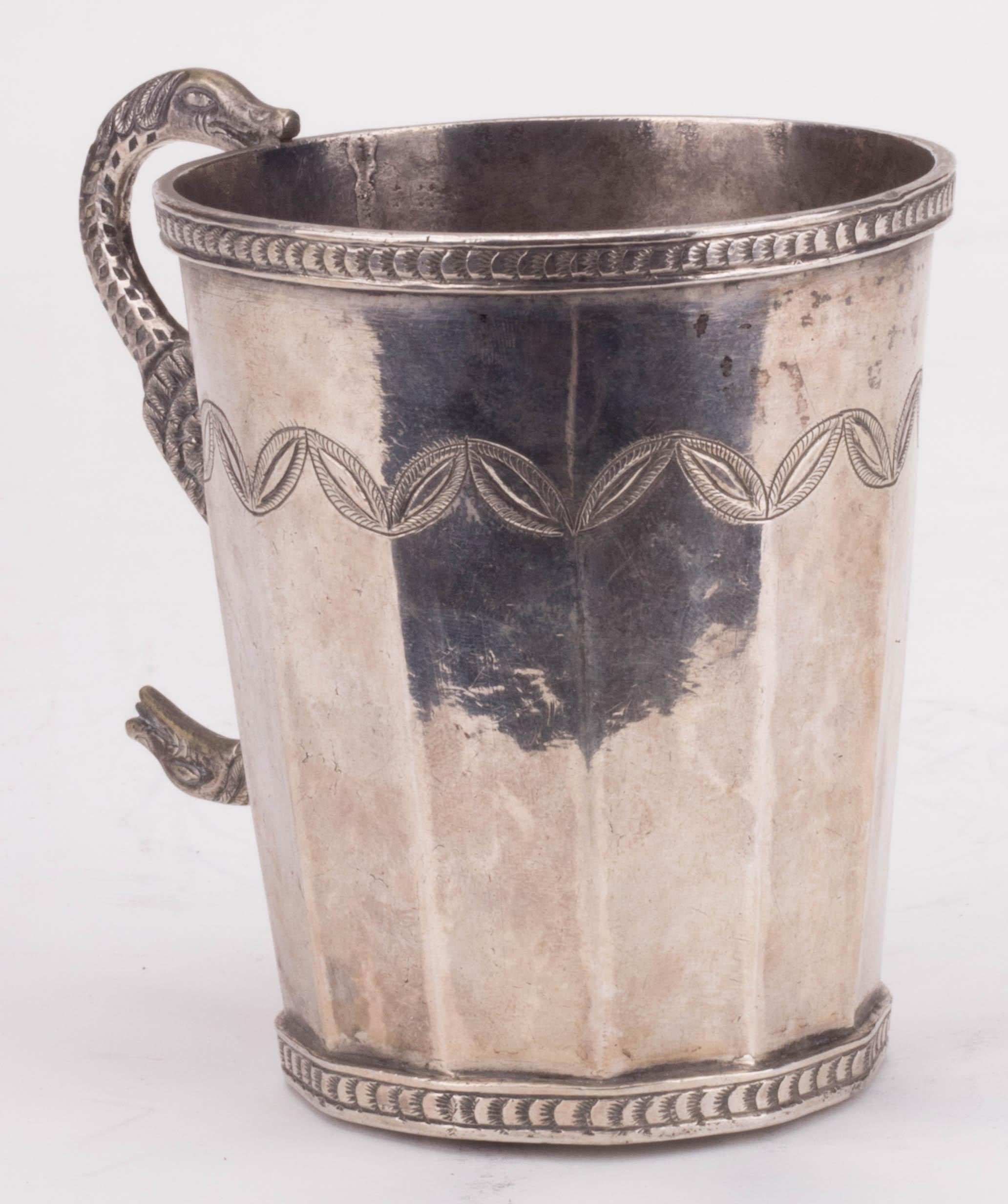 18th century probably Peruvian silver engraved jug with snake shaped handle. 

Silver by weight: 285 g.