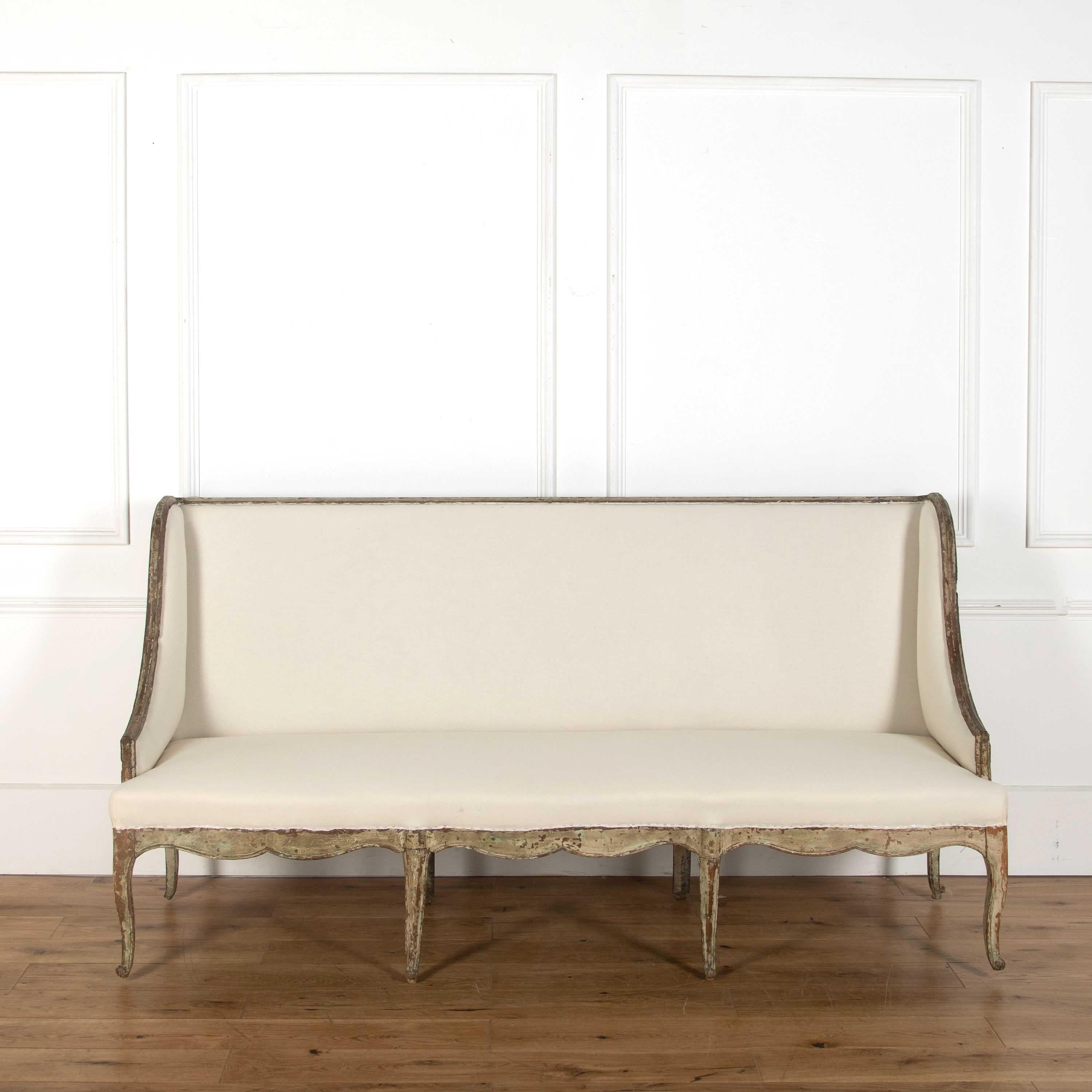 A rare and elegant 18th century Provencal sofa in original paint, recovered to calico.