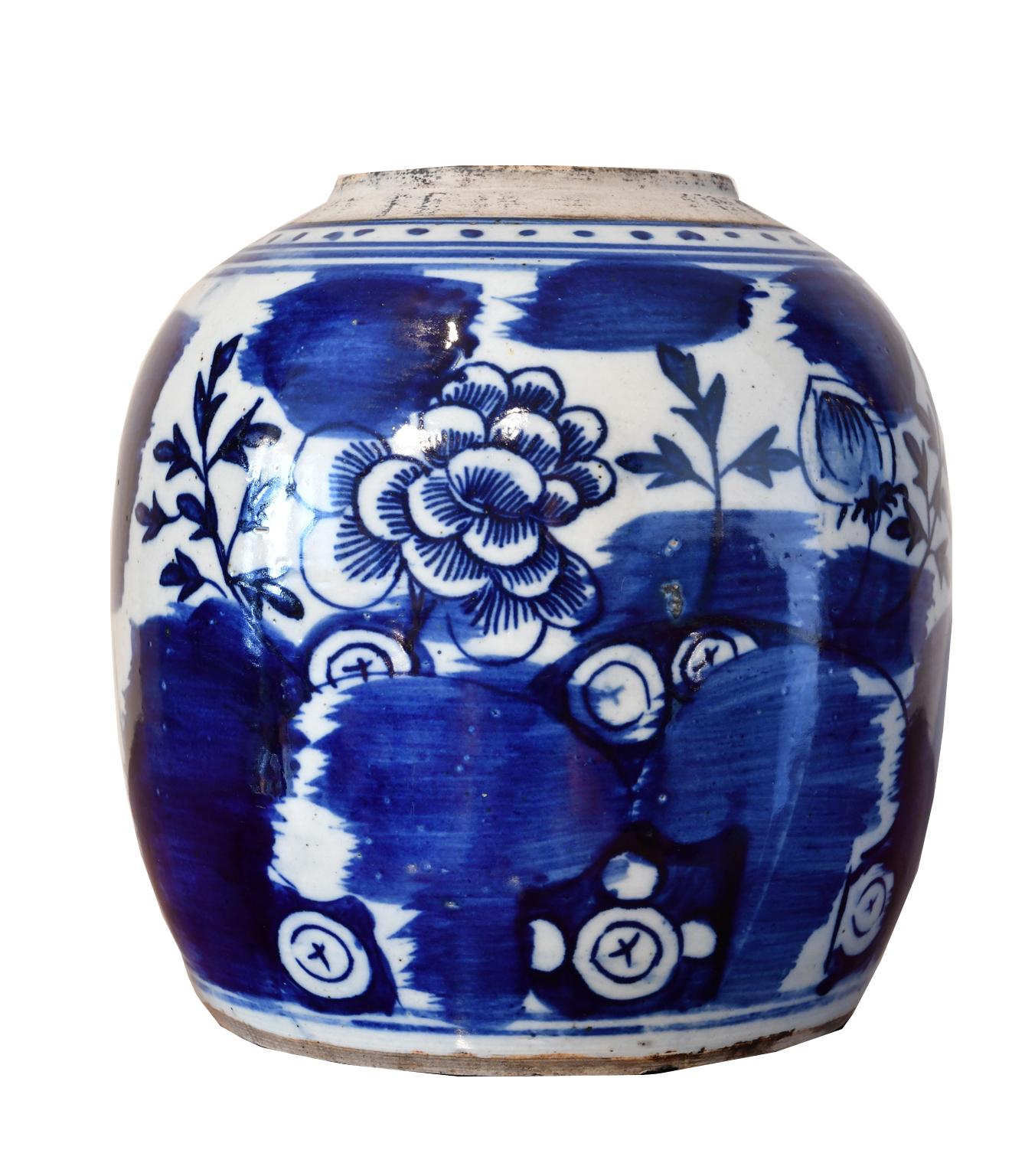 A very beautiful Chinese porcelain jar with hand-painted cobalt blue decorative elements that include a large peony blossom, which in Chinese art symbolizes beauty, rank, higher social status, luxury and opulence. Also depicted, amidst bold patches