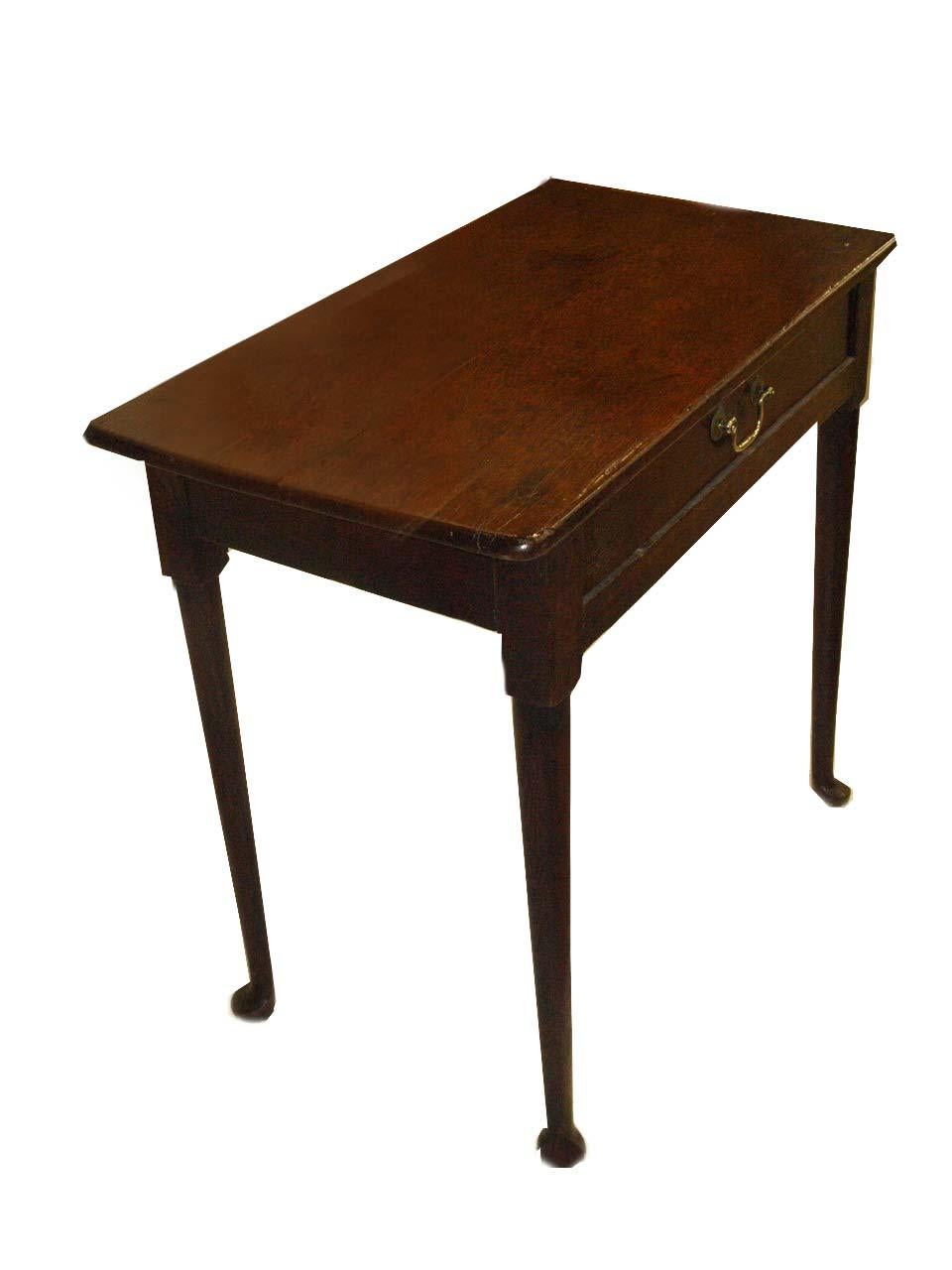 Queen Anne oak one drawer table dating to the early 1700's. This one drawer table has nicely shaped legs ending with pad feet. The brass handle has been replaced (it probably had a tear drop pull originally).
