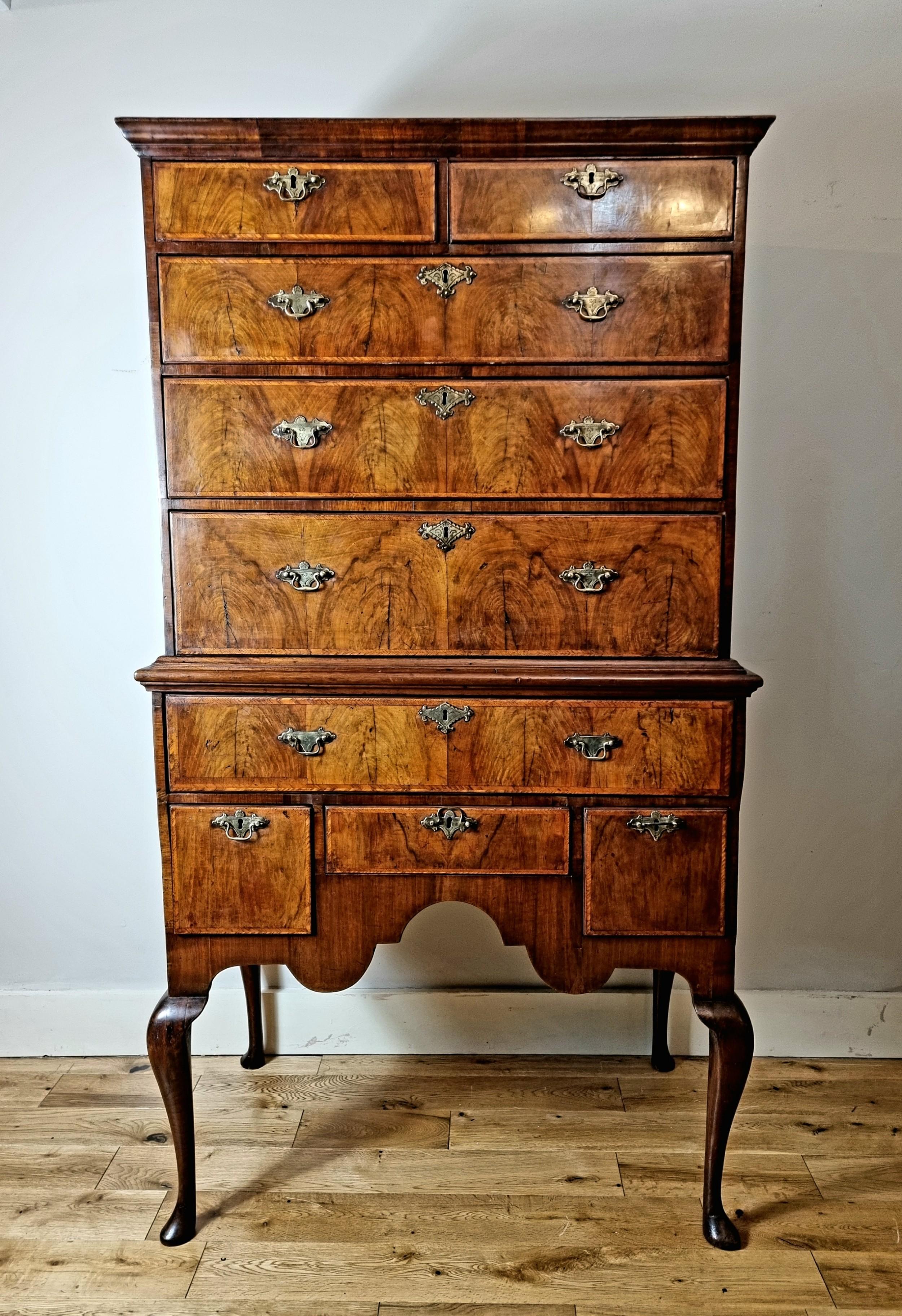 An exceptional early 18th Century Queen Anne period Walnut Chest On Stand / Highboy , dating to 1702-14 .
 
Impeccable colour and patina . Beautiful figured walnut veneers with delicate feather banding to the edges of the drawers . Original chased