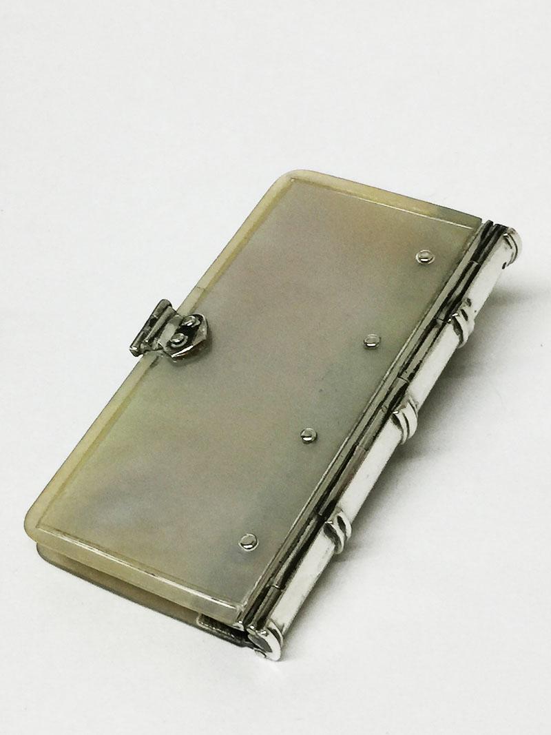 18th century rare Dutch mother of pearl pin booklet with a silver back and lock

A mother of pearl pin booklet with a silver back and lock. 
On the inside, the booklet has some cardboard pages for inserting pins or needles, which were pinned to a