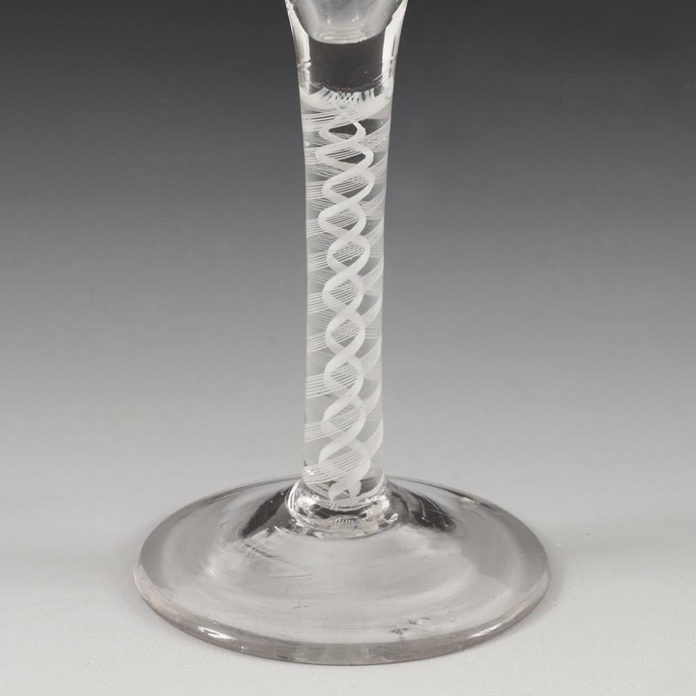 Heading : Double series opaque twist Georgian ratafia glass
Period : George II / George III - c1760
Origin : England
Colour : Clear
Bowl : Round funnel with rib moulding
Stem : A pair of 7-ply spiral bands outwith a pair of corkscrew tapes
Foot :