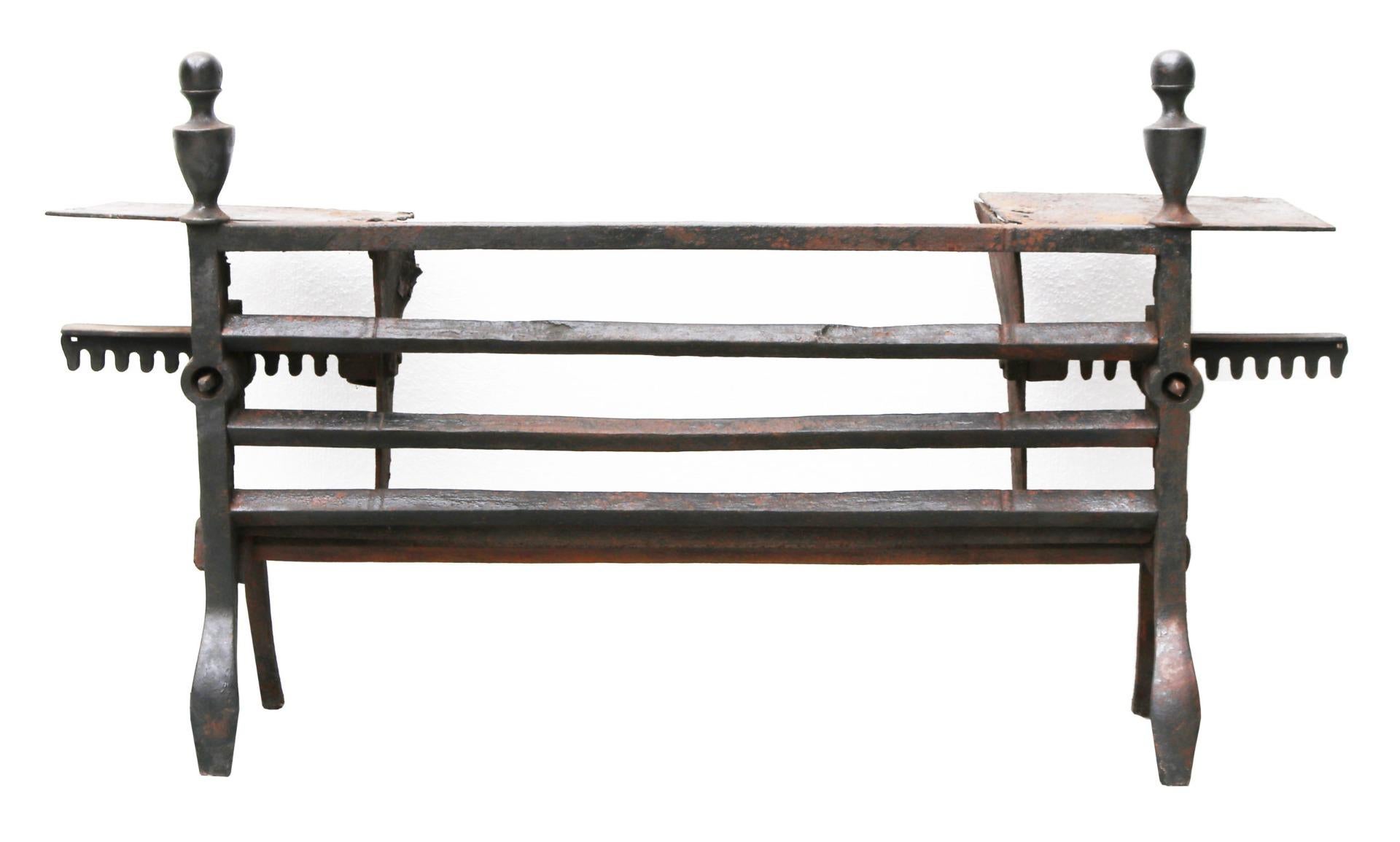 An English Late Georgian period adjustable fire grate.

Additional Dimensions:

The width is adjustable between 84 and 134 cm.
