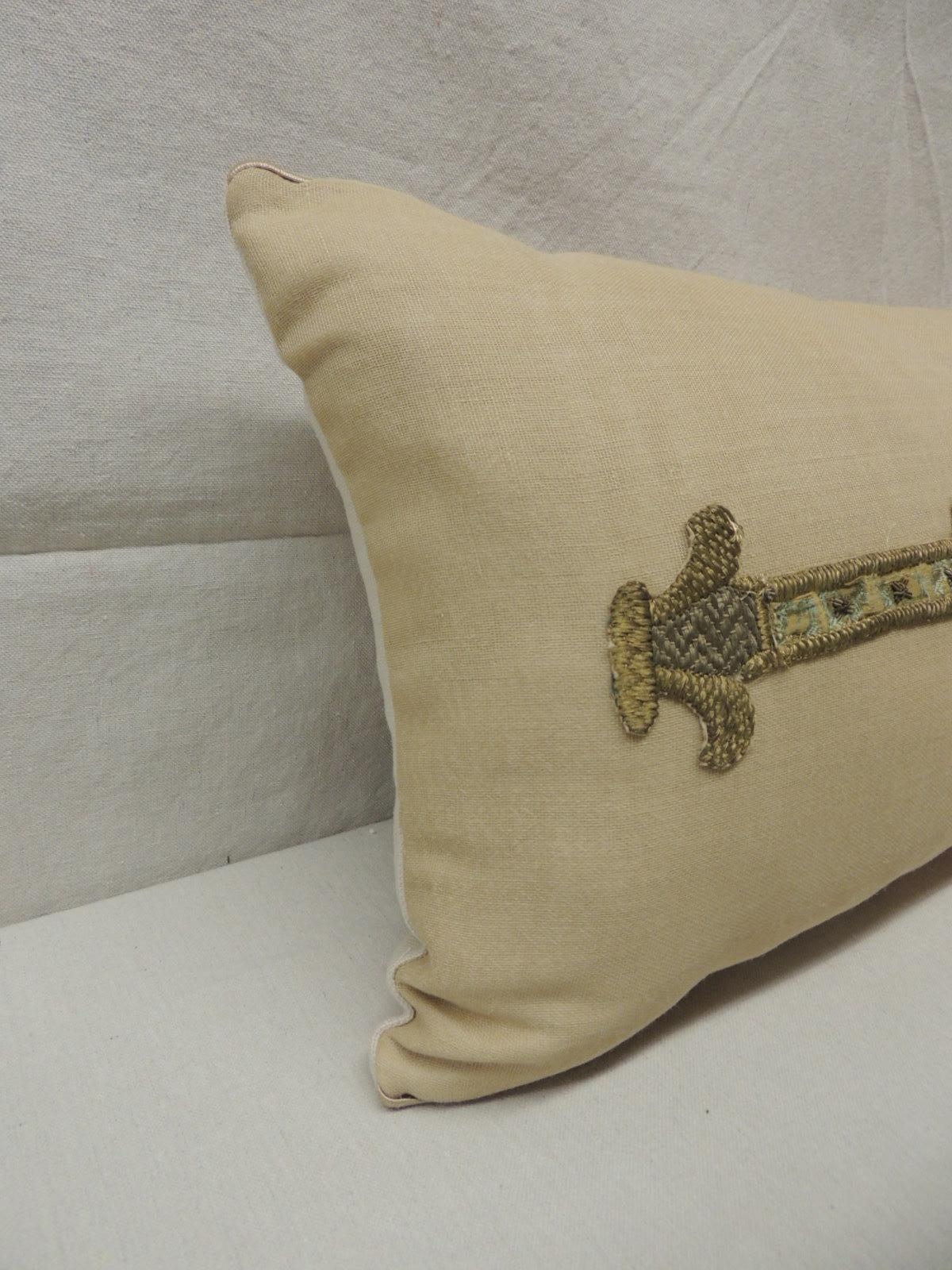 18th century red and gold embroidered linen appliqué long bolster decorative pillow.
An 18th century long bolster decorative pillow. Metallic threads, cotton and silk embroidery applied onto sheer beige color linen accentuated with silvery color