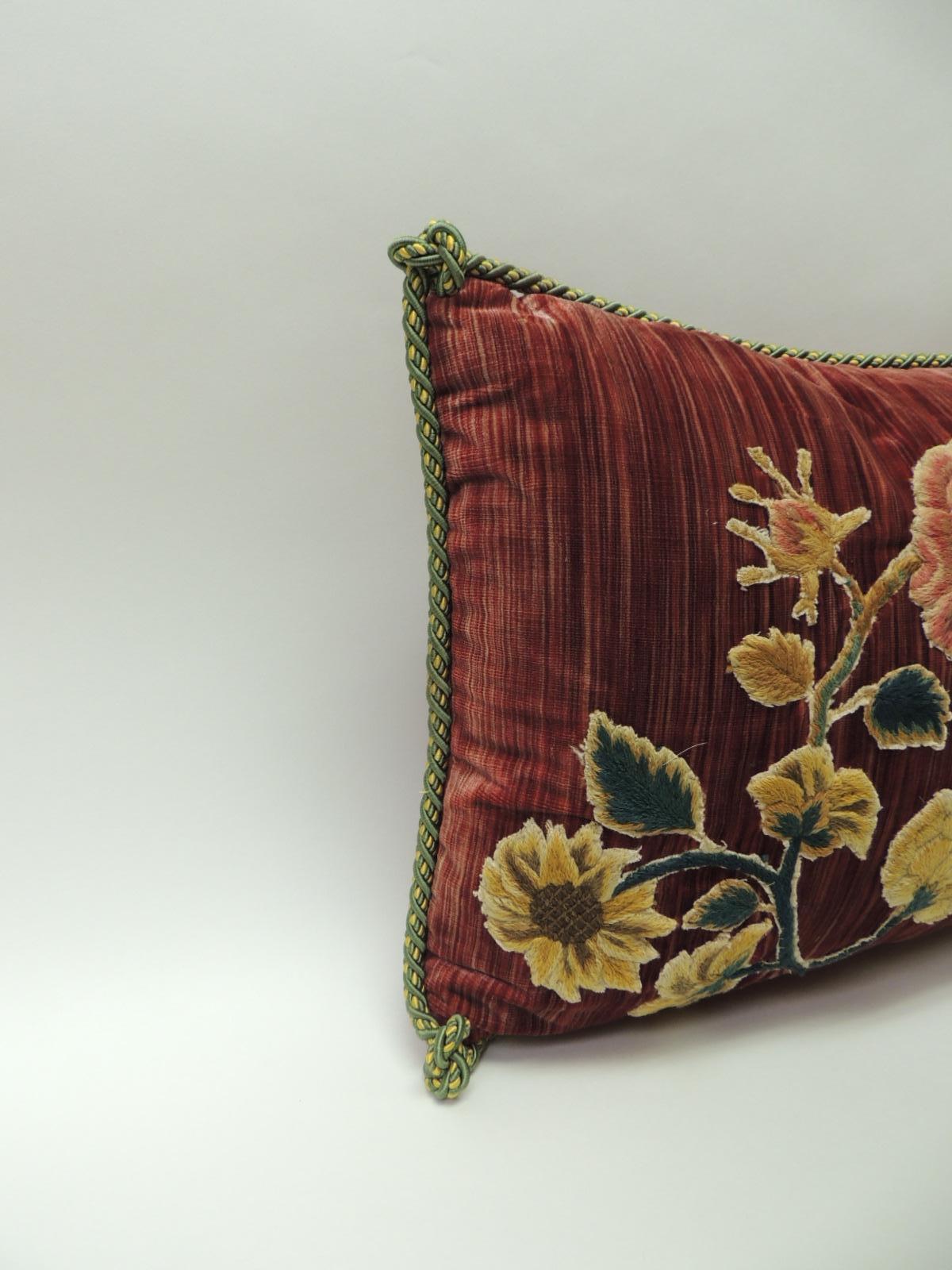 18th century red hand-appliqué bolster decorative silk velvet pillow, 18th century floral embroidery transferred onto red lush silk velvet panel and silk backing. Throw pillow embellished with a green and gold twisted rope trim. Red cashmere