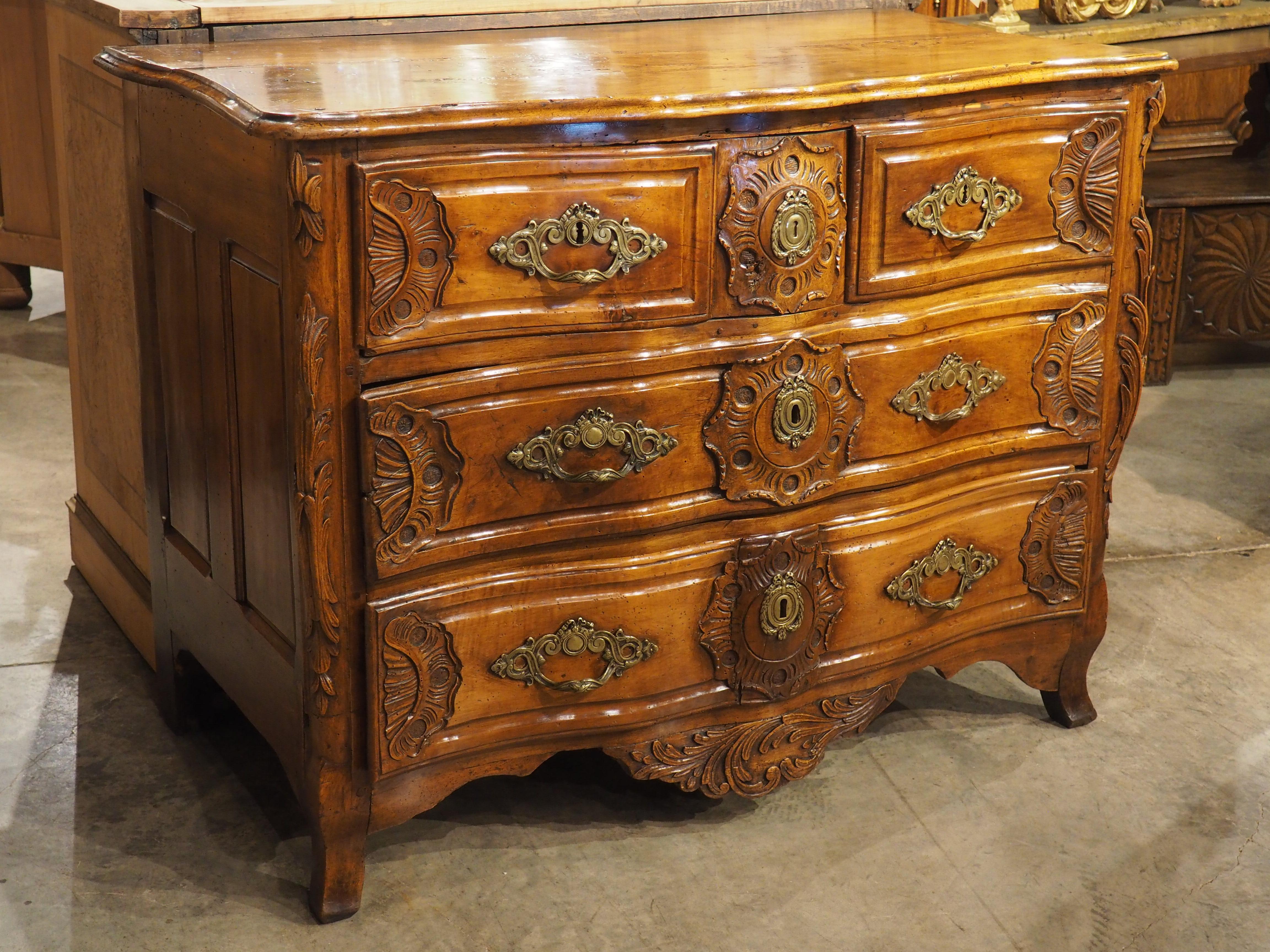 French 18th Century Regence Period Carved Walnut Lyonnaise Commode 'Arbalete' For Sale
