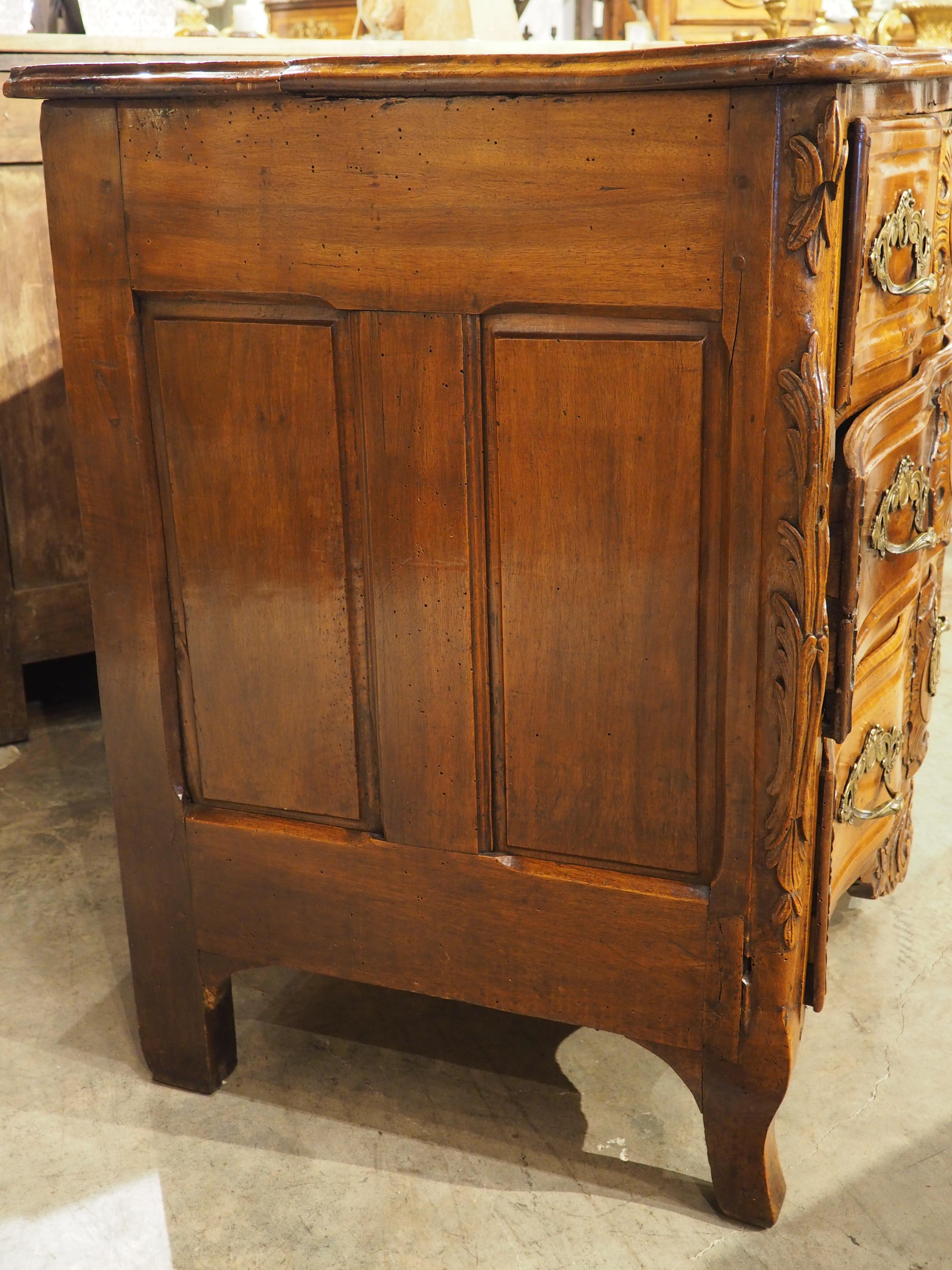 Hand-Carved 18th Century Regence Period Carved Walnut Lyonnaise Commode 'Arbalete' For Sale