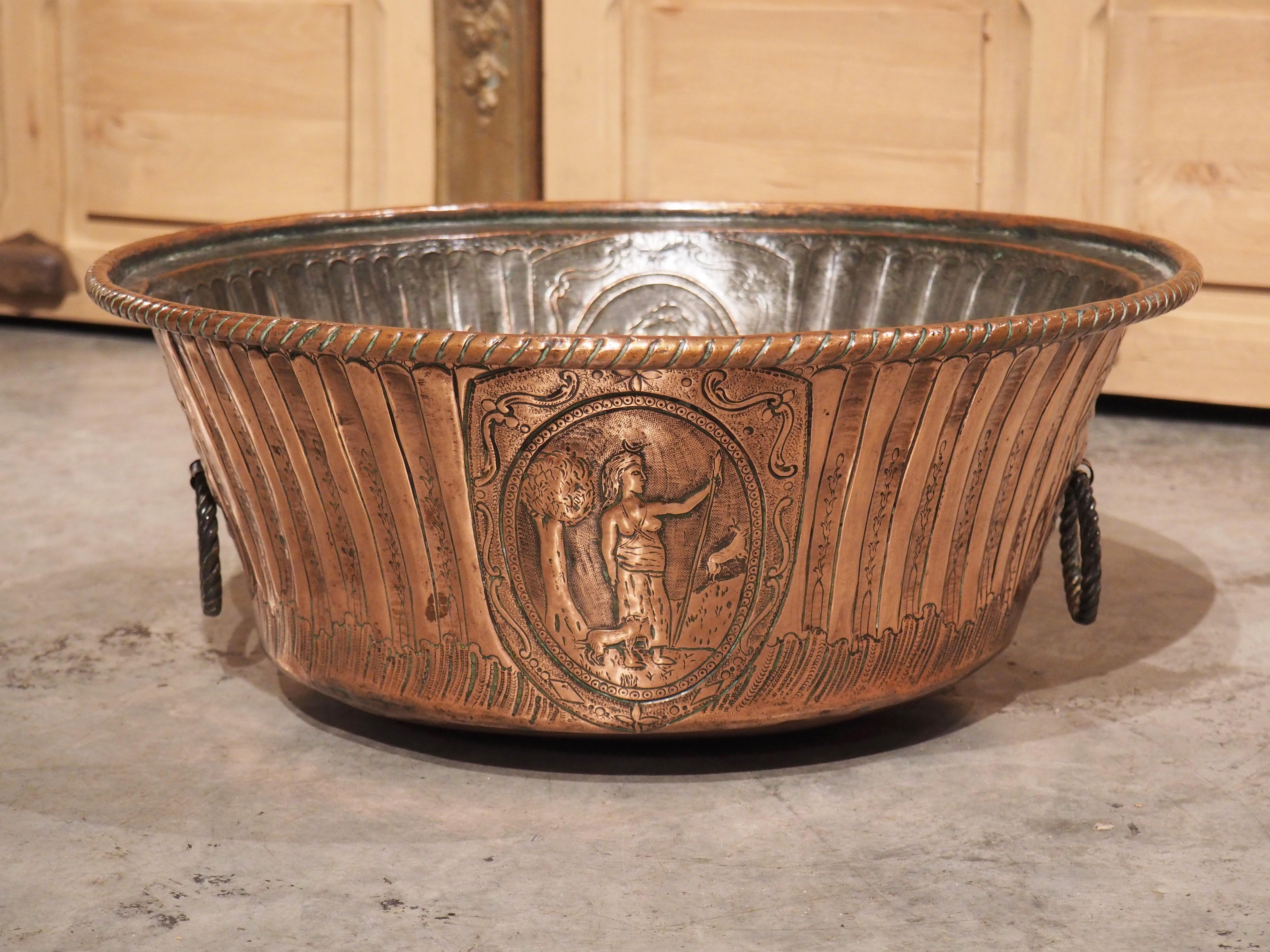 A beautiful example of a period Louis XVI chaudron, or cauldron, the copper has been decorated with a metalworking technique known as repousse, where low relief motifs are hammered from the reverse side. Many motifs from Louis XVI were inspired by