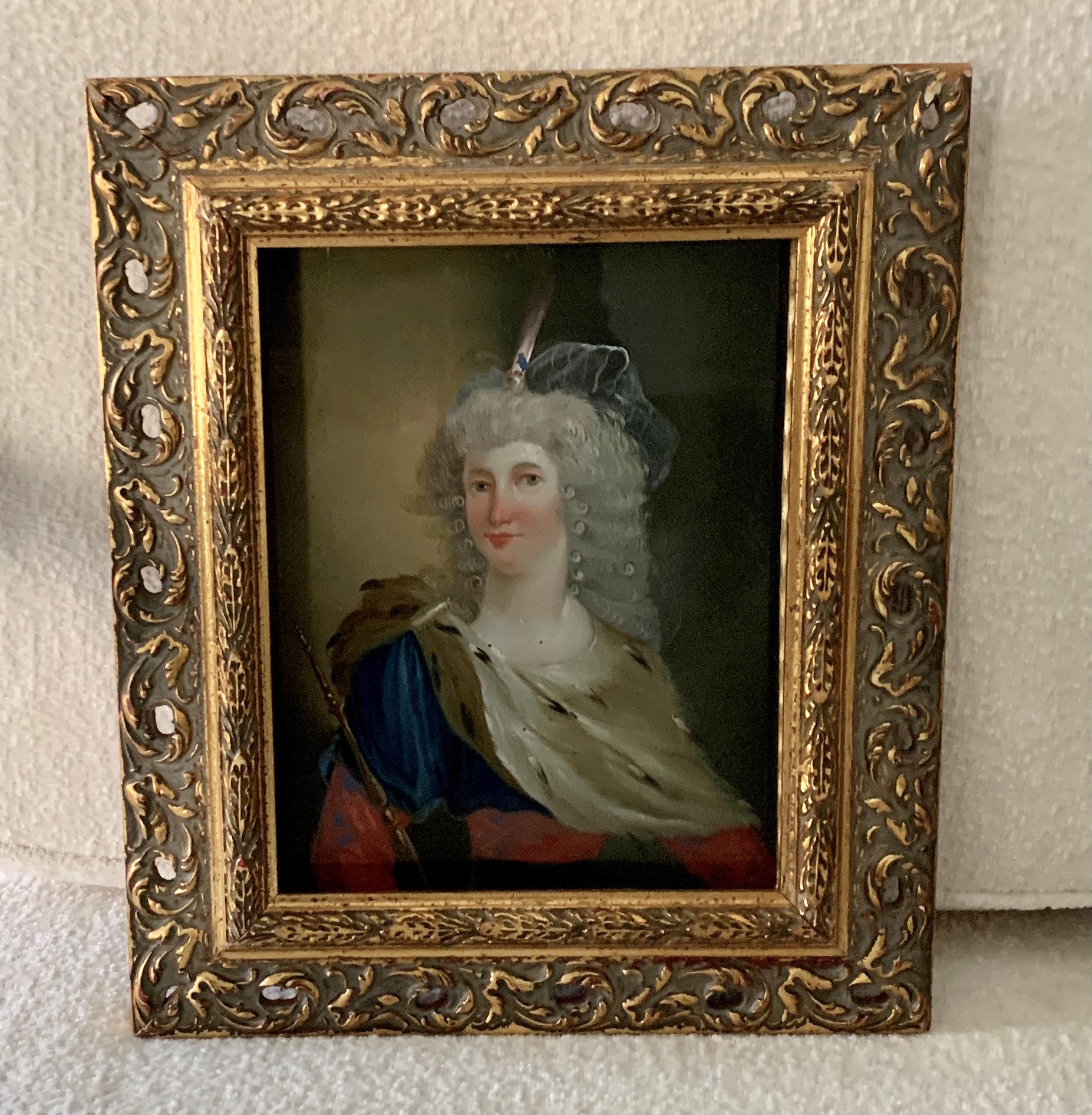 A wonderful reverse painted glass image. The image of a 17th C. female is wonderfully done and in very nice colors. The Frame is gilt and the image sits back, creating a shadow affect. Truly a wonderful focal point for any room or library, den, etc.