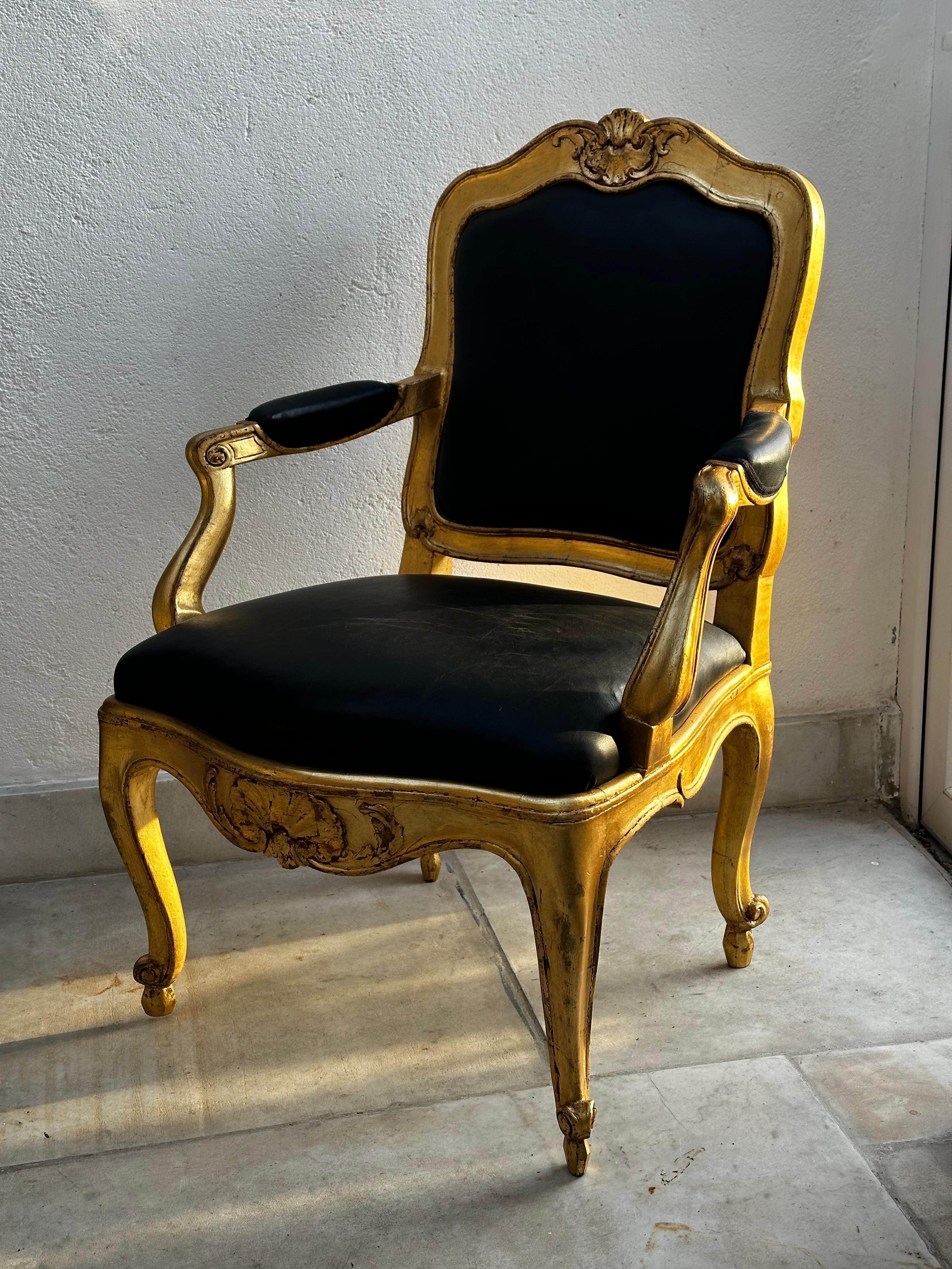A pair of high class  rococo armchairs made in Stockholm. This type of armchairs with loose back plate were made in the Castle workshop. Front legs are decorated with acanthus leafs and the front top and bottom with rocailles.

The word Rococo is