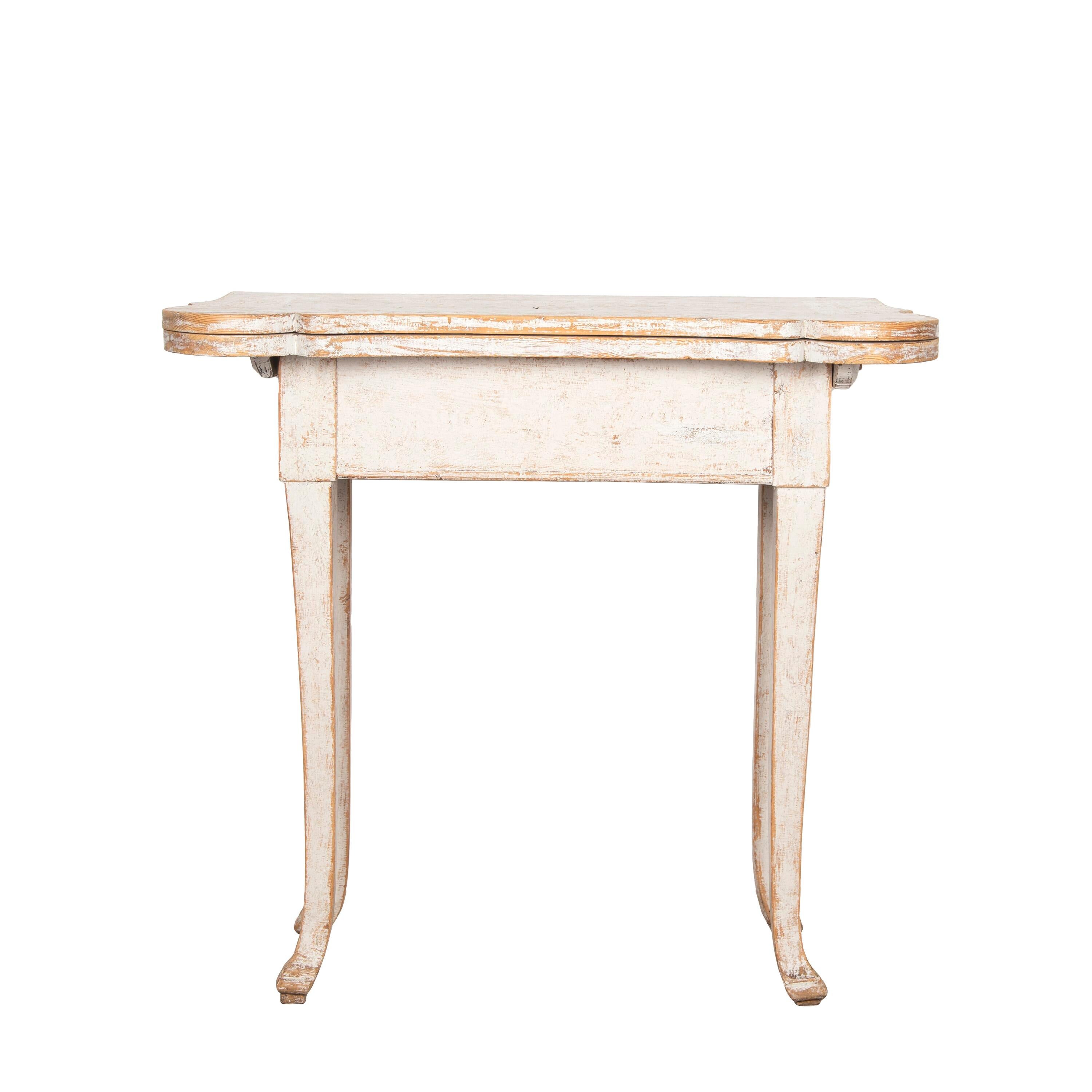 Unusual Swedish 18th century Rococo folding card table.
Repainted in soft grey and beautifully distressed.