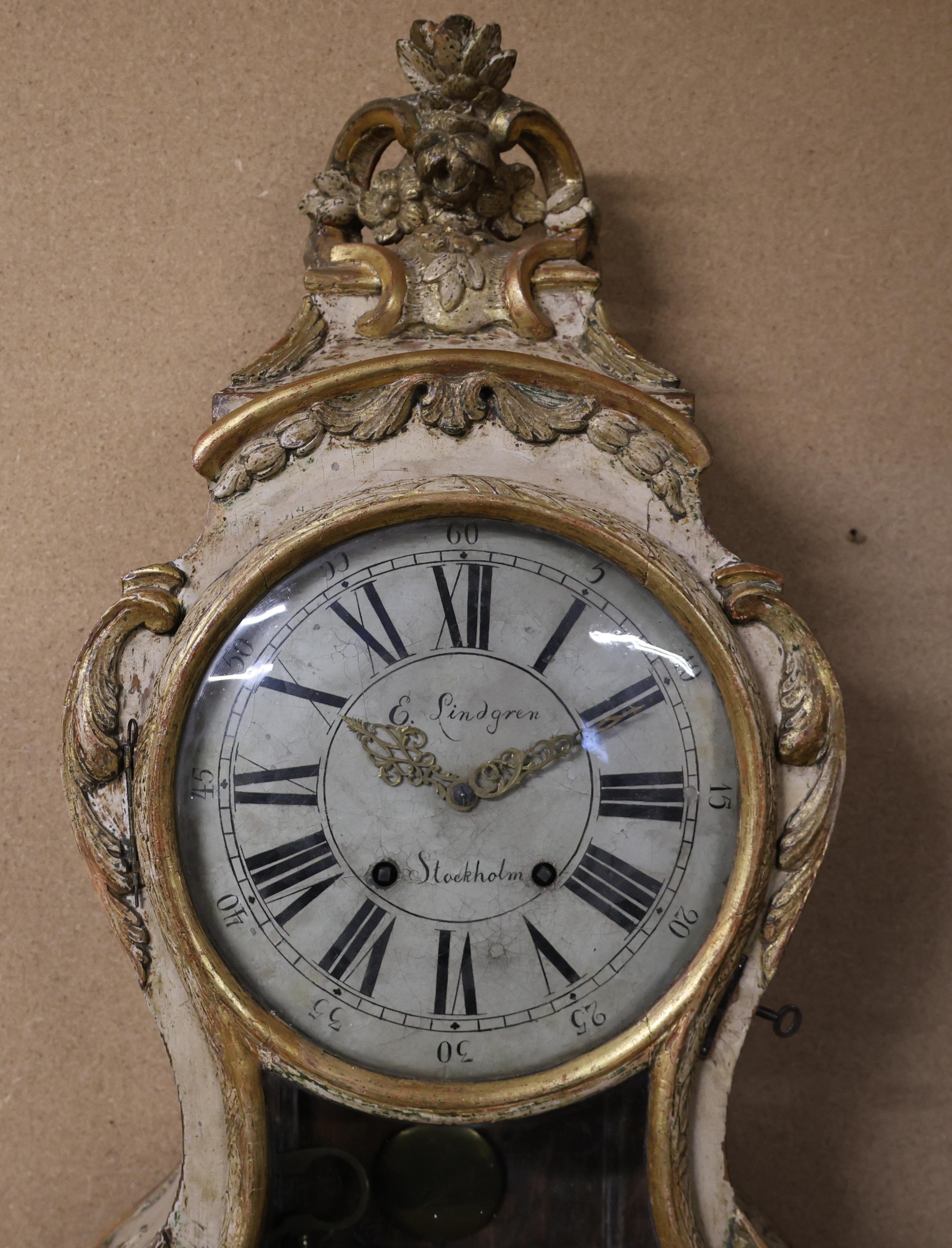 A Rococo console clock with the movement crafted by Eric Lindgren Jr. (active 1754–1786, appointed Royal Clockmaker in 1776) in Stockholm. The case features a beautifully revealed original finish, and its exquisite Rococo carvings enhance the