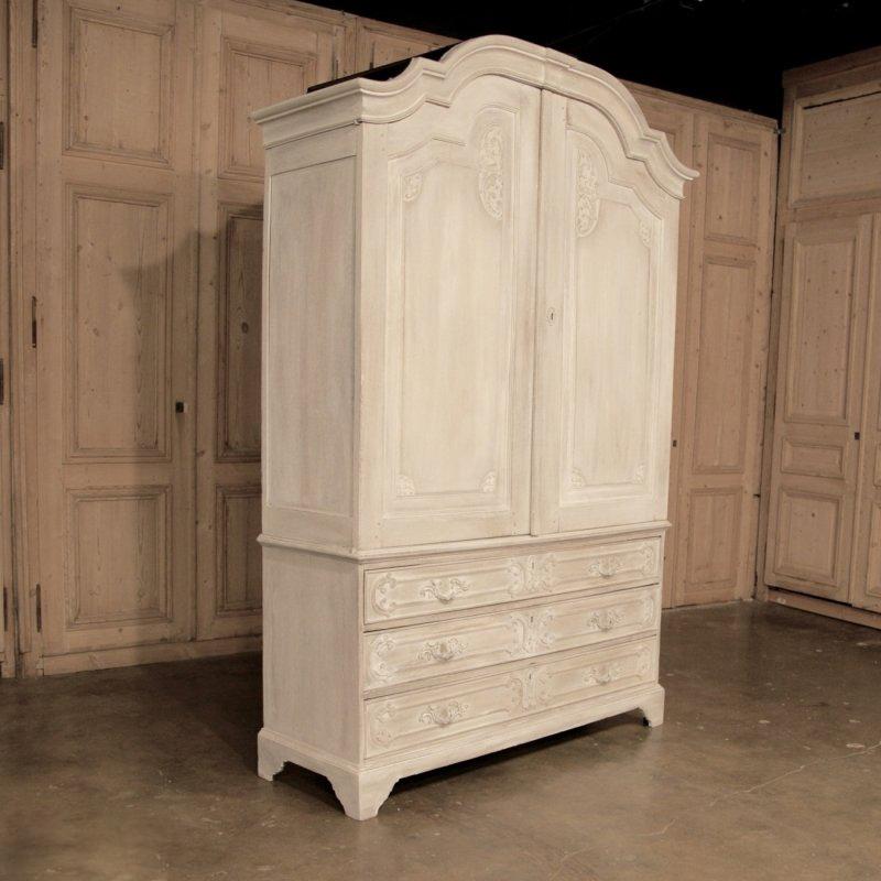 18th century Rococo period Dutch Country linen press cabinet or armoire provides dual purposes with aplomb, and is a perfect choice for the entertainment center! Originally a linen press, carved from solid European white oak almost 300 years ago.