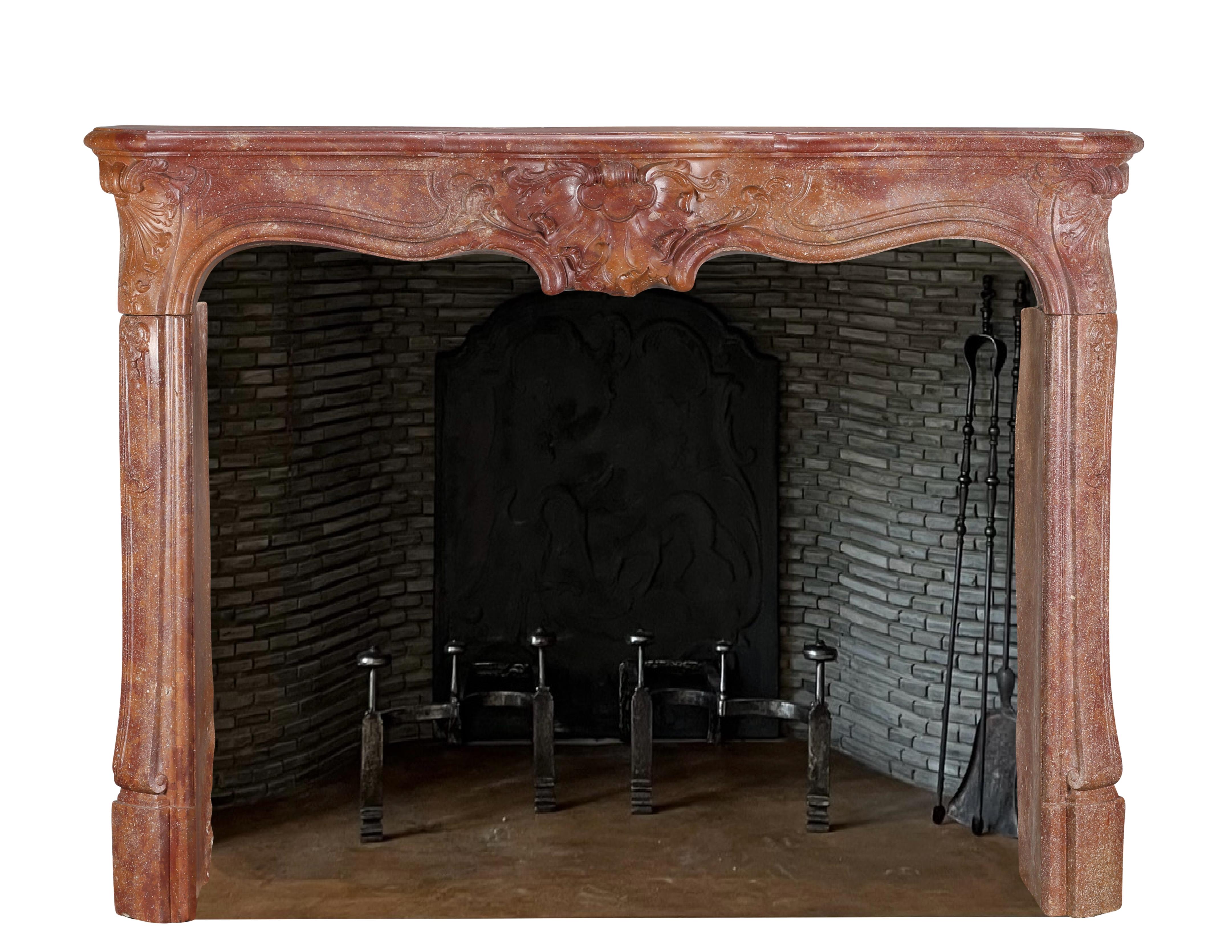 Hand-Carved 18th Century Rococo Fireplace Mantel In Reddish-Brown or Porphyry-Like Stone For Sale