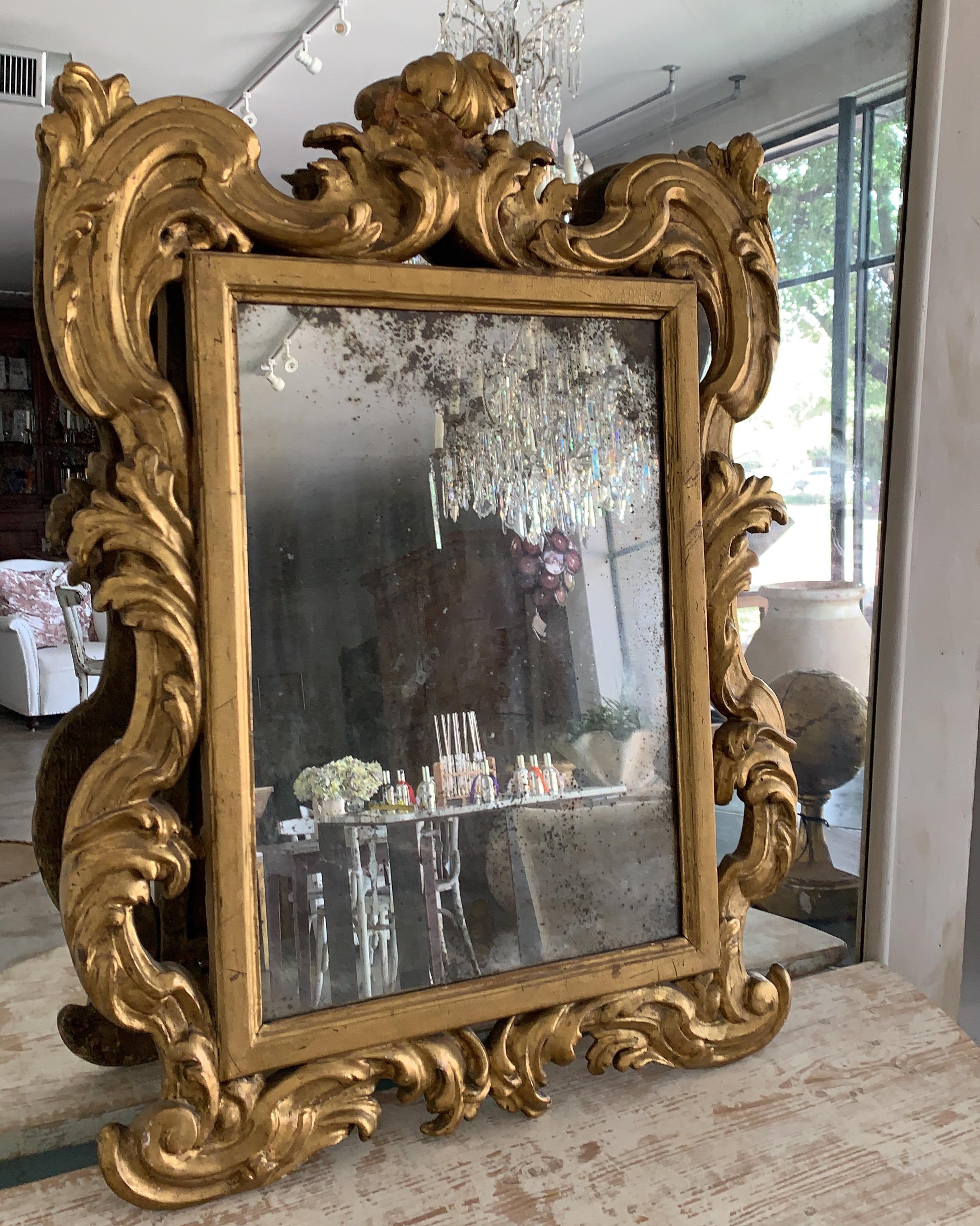 Hand-Carved 18th Century Rococo Italian Hand Carved Gilt Pair Of Mirrors For Sale