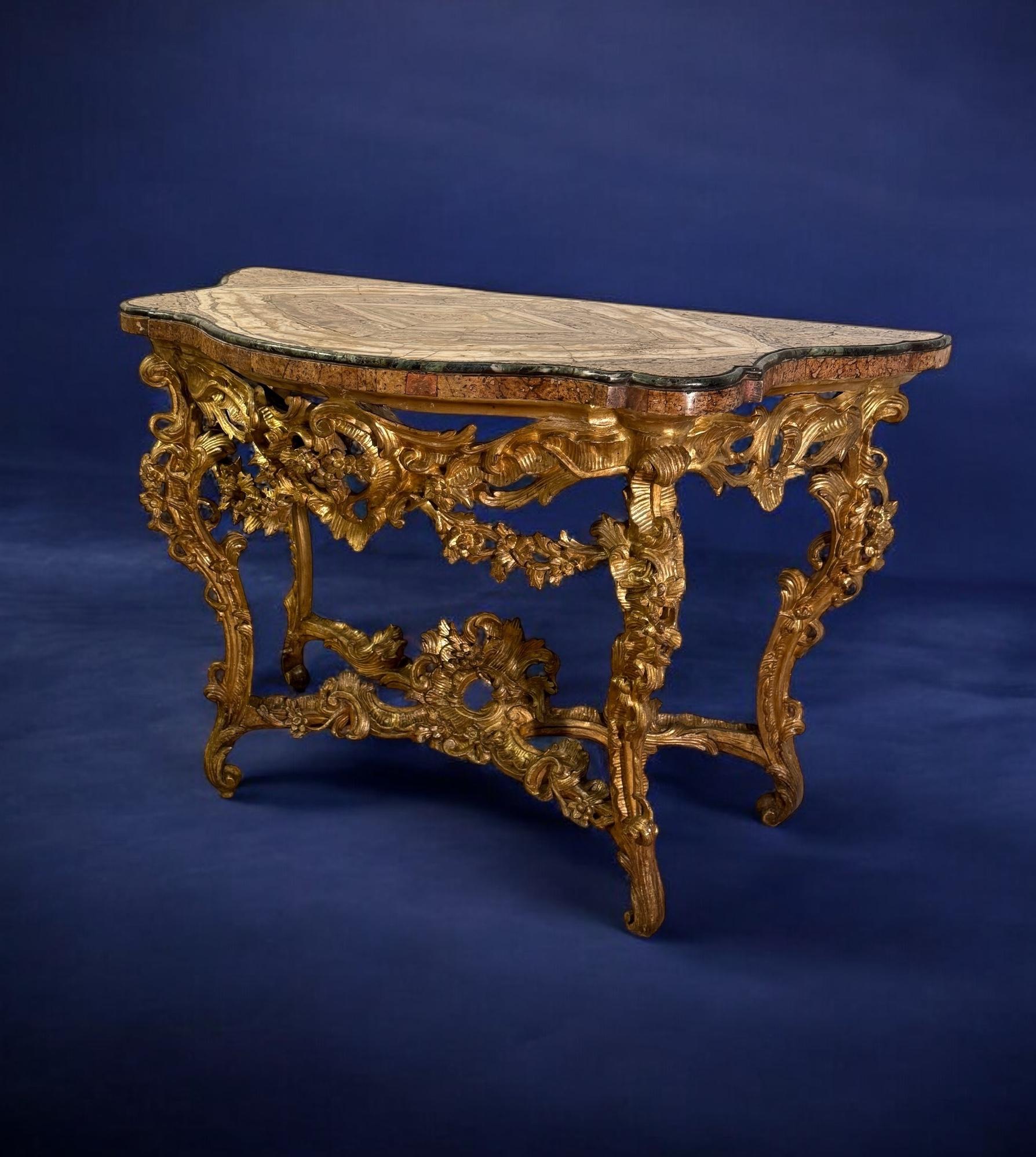 A fabulous  Roman mid-18th century giltwood Rococo consoles
 with a precious 