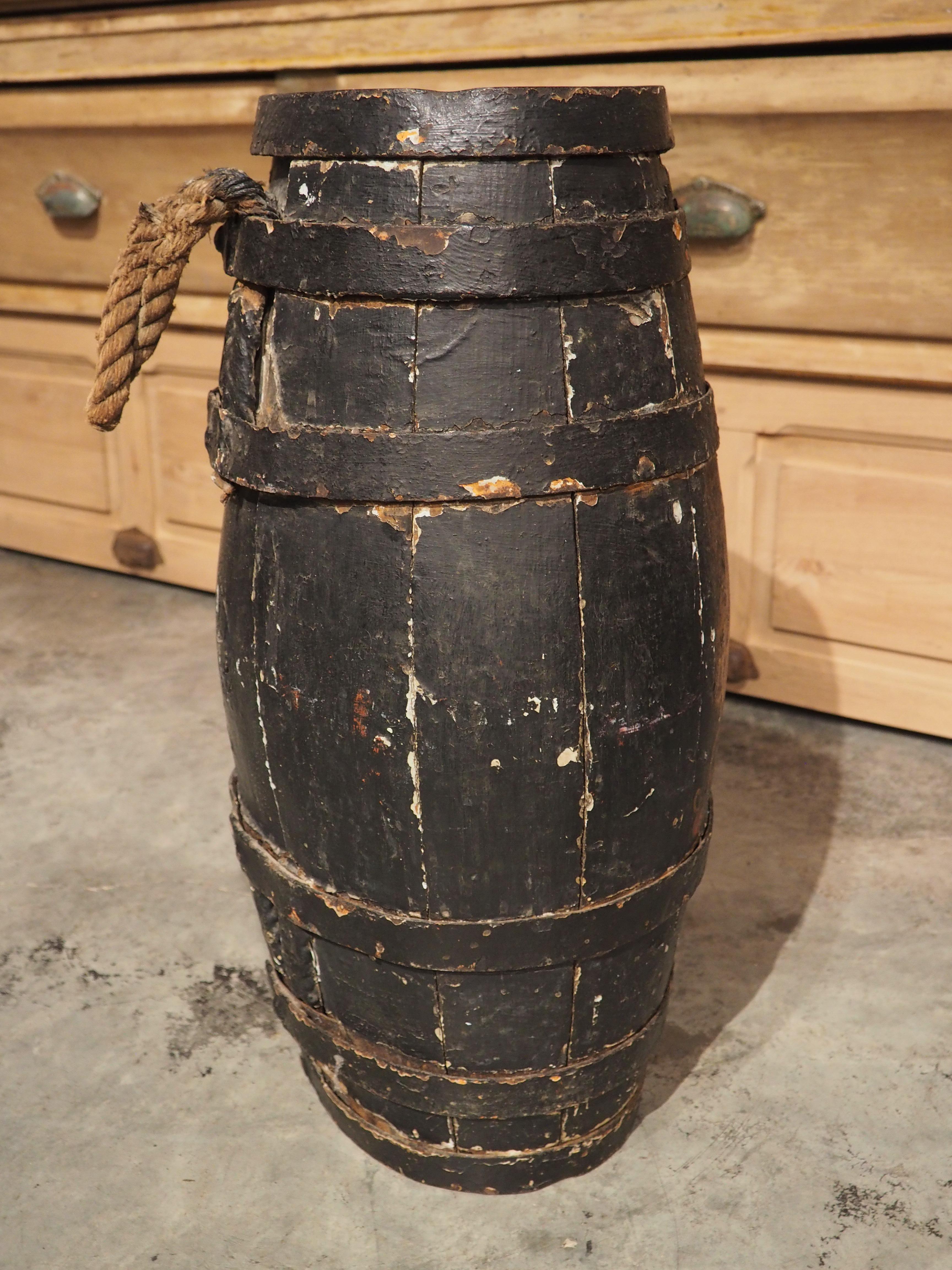 Crafted during the 1700s, this oak barrel features a hand-painted version of the Royal coat of arms of the United Kingdom. The barrel would have most likely been used on a naval ship, either to store gun powder or for serving grog, which was rum