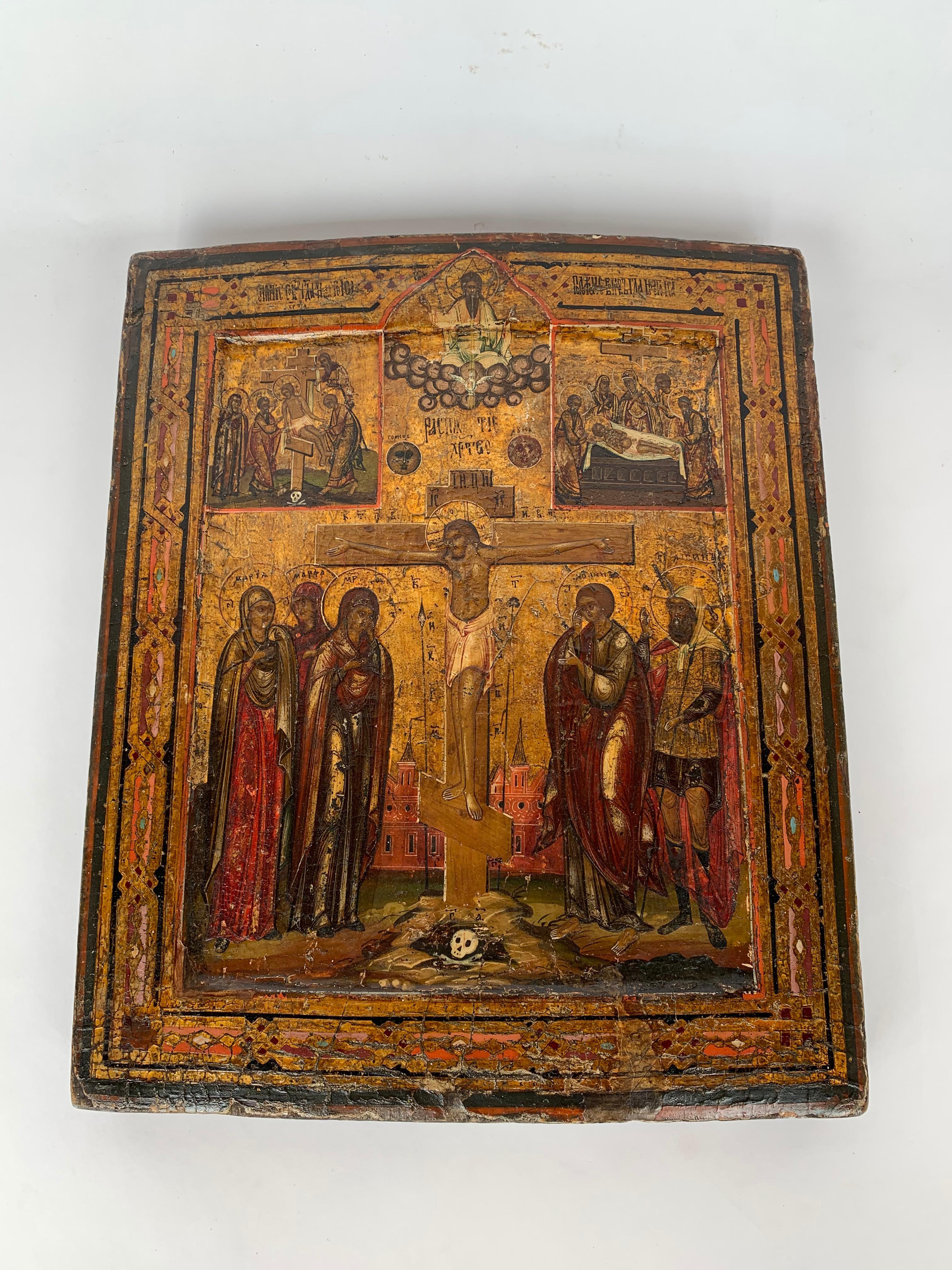 18th century Russian and parcel gilt icon depicting the crucifixion of Christ