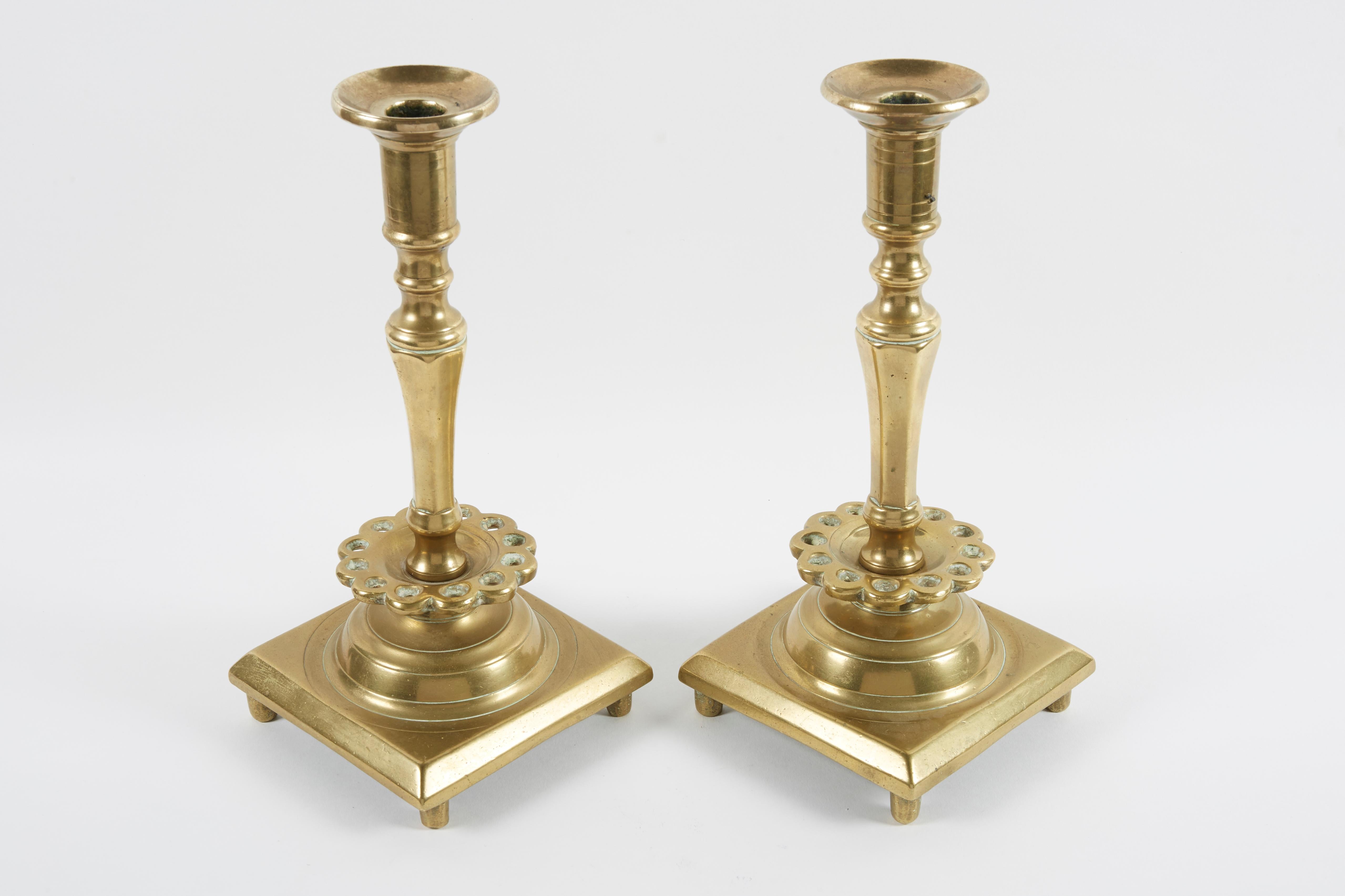 Early pair of brass Sabbath candlesticks
Hand-turned, of very heavy construction, each resting on four peg feet.
Russia, circa 1700.
For the Jews located in the large swath of territory known as the “Pale of
the Settlement”, candlesticks such as