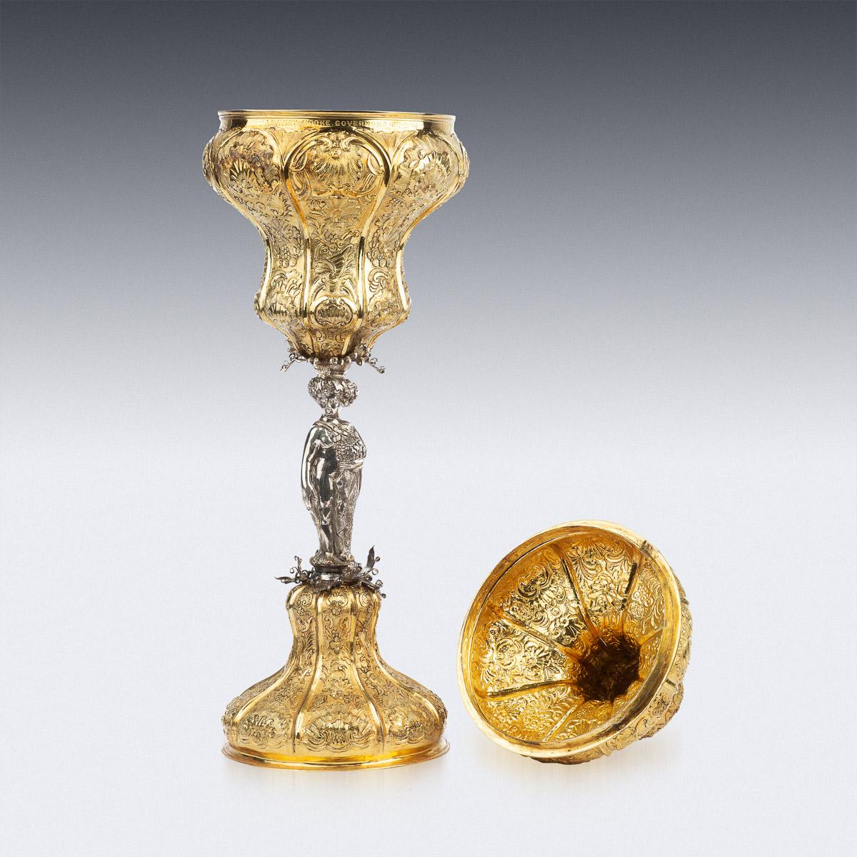 Antique mid-18th Century Russian Monumental solid silver-gilt cup with cover, of fluted baluster form, the body and lid highly embossed with scrolls and foliage decorations, standing on domed foot and applied with a decorative figural stem, the lid