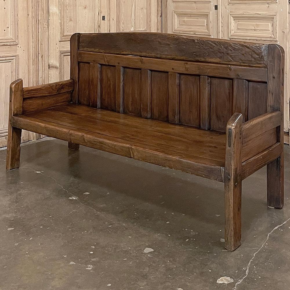 18th Century Rustic Bench is a fine example of rural craftsmanship utilizing time-honored techniques that were handed down from generation to generation for centuries in northern Europe.  Utilizing dense, old-growth oak, a gently arched seat back