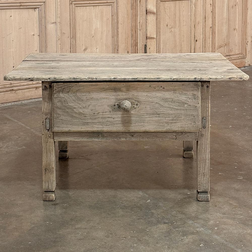 18th Century Rustic Country French End Table in Stripped Elmwood represents the essence of essential furnishings hand-crafted by able artisans who utilized tools that we consider primitive by today's standards, yet produced furniture that literally