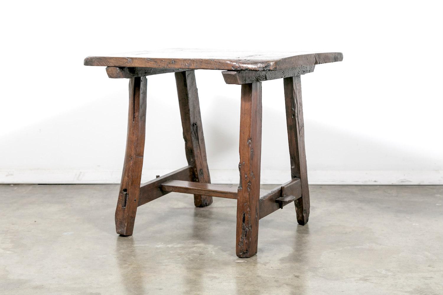 A charming French Country side or occasional table handcrafted of fruitwood in the South of France during the mid-18th century. Perfect as a little drink table or end table, this very rustic table with its wonderful aged patina, has tons of
