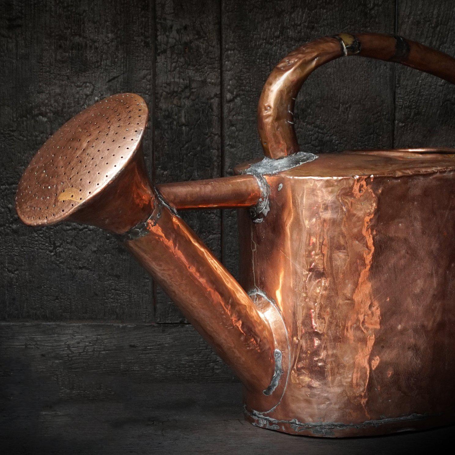 antique copper watering can