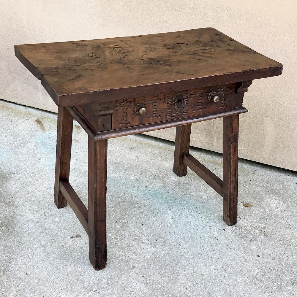 18th Century Rustic Spanish End Table was hand-crafted from old-growth indigenous walnut to last for centuries! Thick, solid plank top appears above the simplistic casework below which contains a single full-width drawer with two brass pulls and an