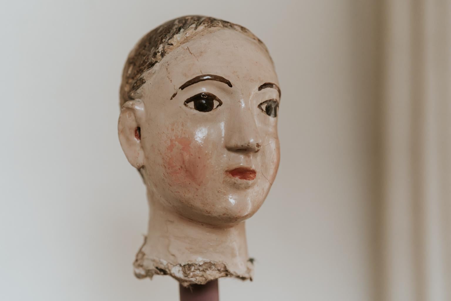 This is an 18th century polychromed terra cotta head of a Santos figure ... Spanish origin ...
on contemporary wooden base ... dimensions are 17 cm high when mounted on base 32 cm.
