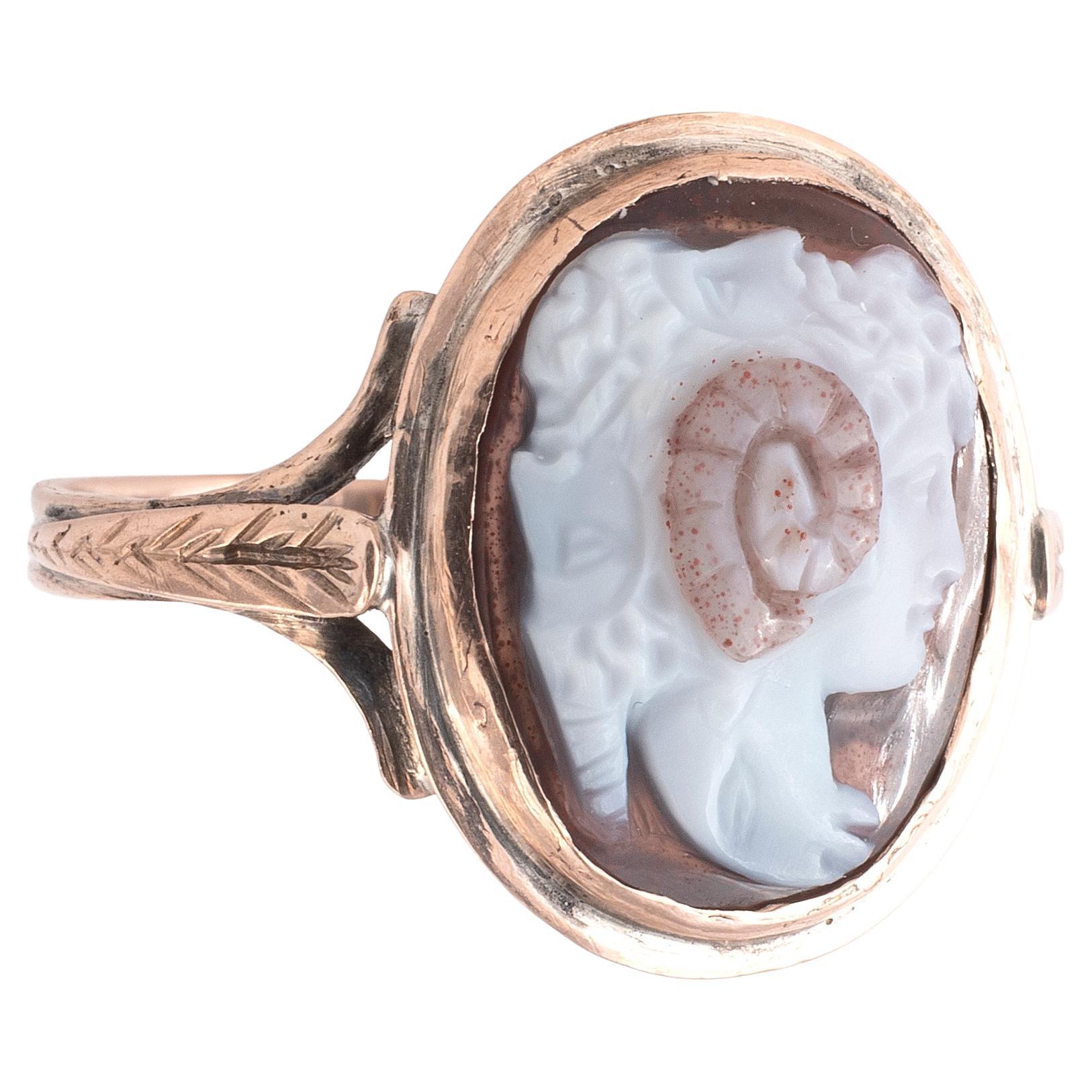 An 18th century sardonyx cameo depicting a gryllus, the conjoined heads of a bearded Zeus Ammon, a young Alexander the Great and a ram's head, in an early 19th century gold ring with bifurcated shoulders, cameo 1.5cm high, ring size 7
A gryllus is a