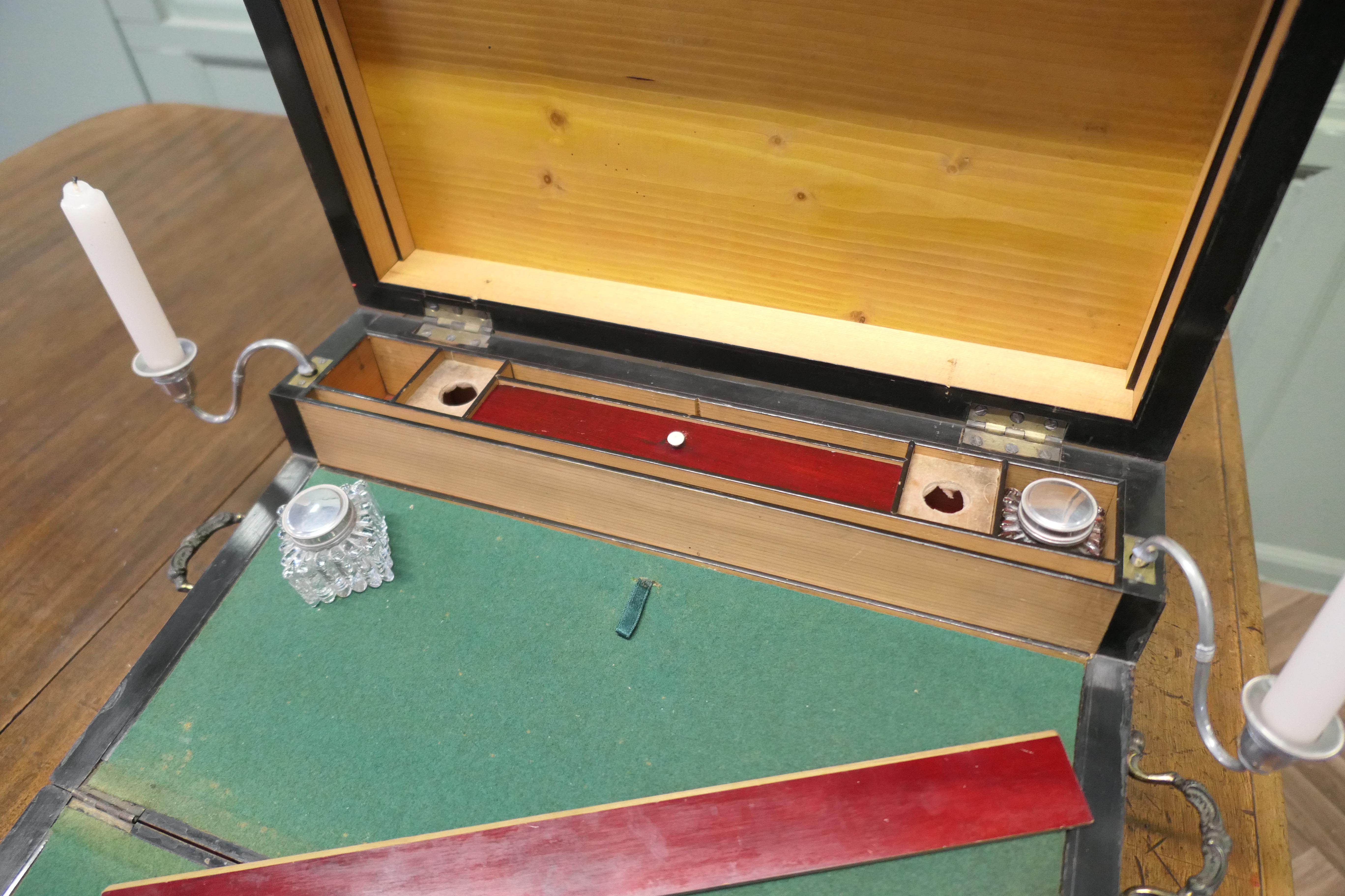 18th Century Satinwood Campaign Writing Slope or Lap Desk 

This is an interesting piece, it is a Traveling Writing Slope, it is a rare piece in design and craftsmanship. The desk has  a section at the top for ruler, pens, ink bottles, candles, etc.