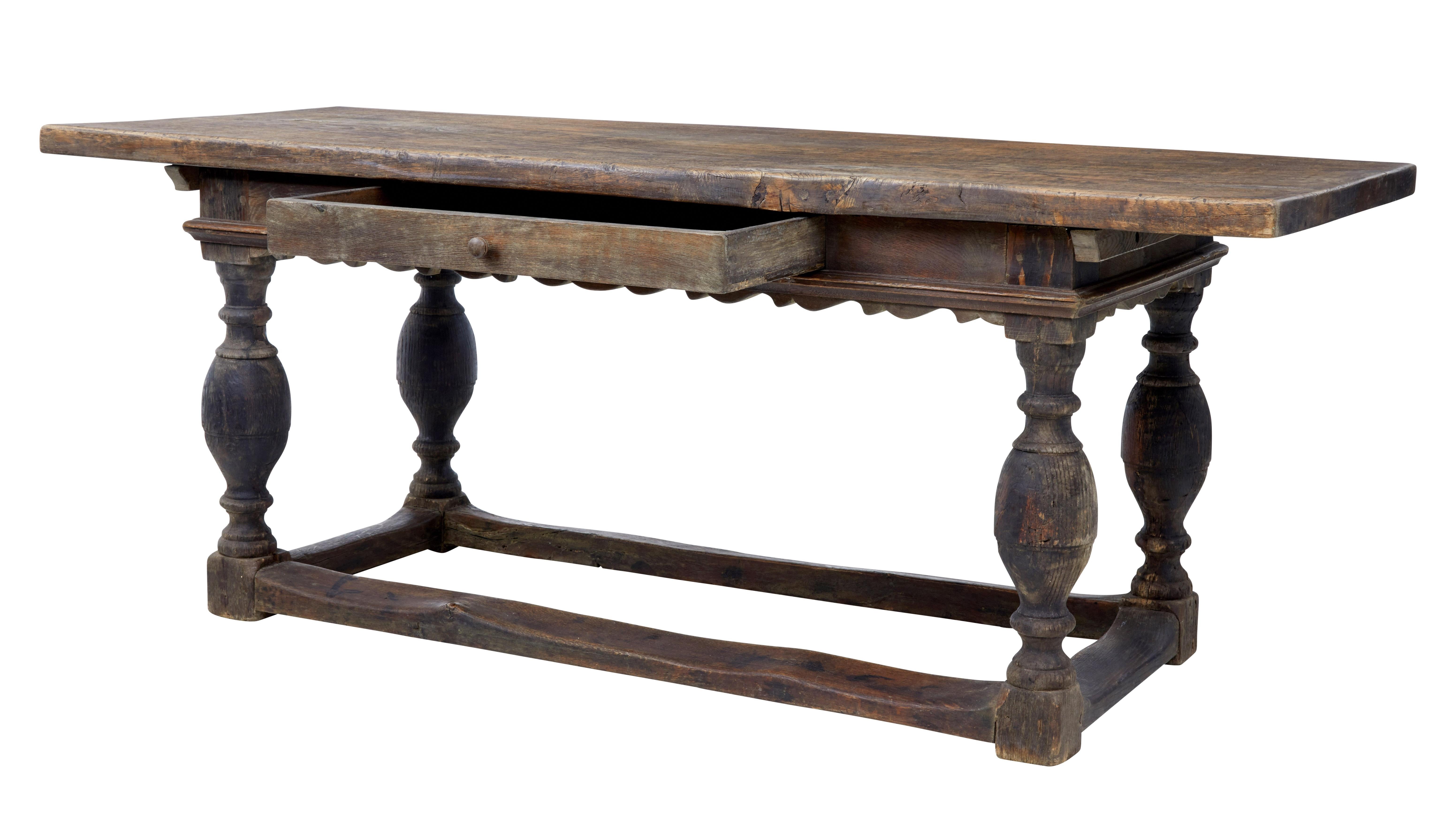 Quality Scandinavian oak table, circa 1800.

We are pleased to this table in untouched original condition.

Near 2 inch thick solid oak top, held in place on the base by barers and pegs.

Shaped apron above the knee with a single deep drawer.