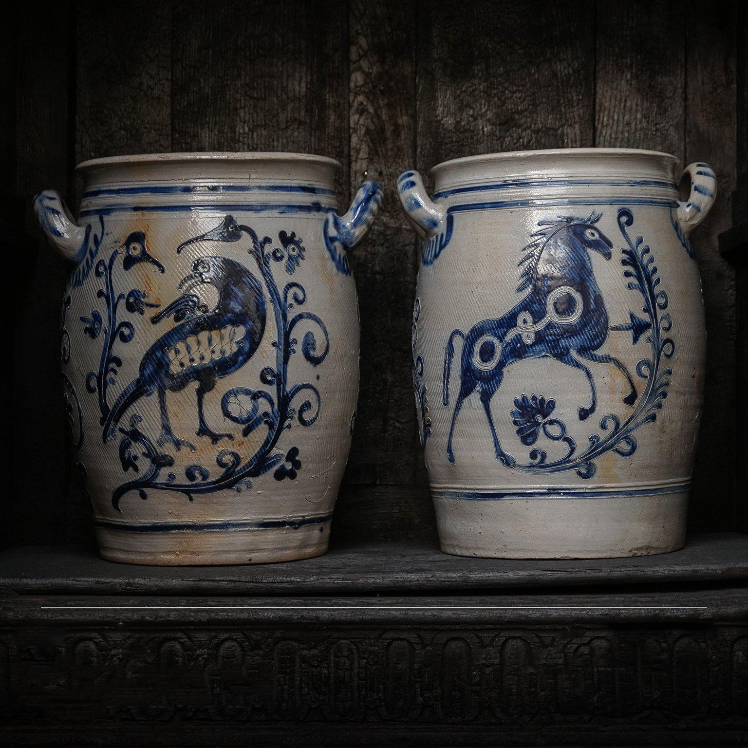 Two large three gallon Westerwald crock pots, open salt glazed two-handled stoneware jars.
Decorated with elaborate bird and leaping horse decorations, great collectors’ items.

The ovoid shaped jars with loop handles are decorated on the front and