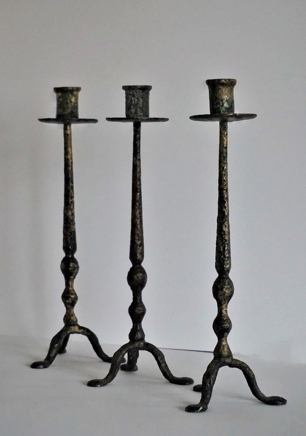 Set of three craft hand forged iron and bronze altar torchères or candleholders, France 18th century. All three candlesticks are in good condition, still with remained melted wax.
Dimensions:
H 15 inches / W 5.12 inches / D 5.12 inches
H 38 cm /