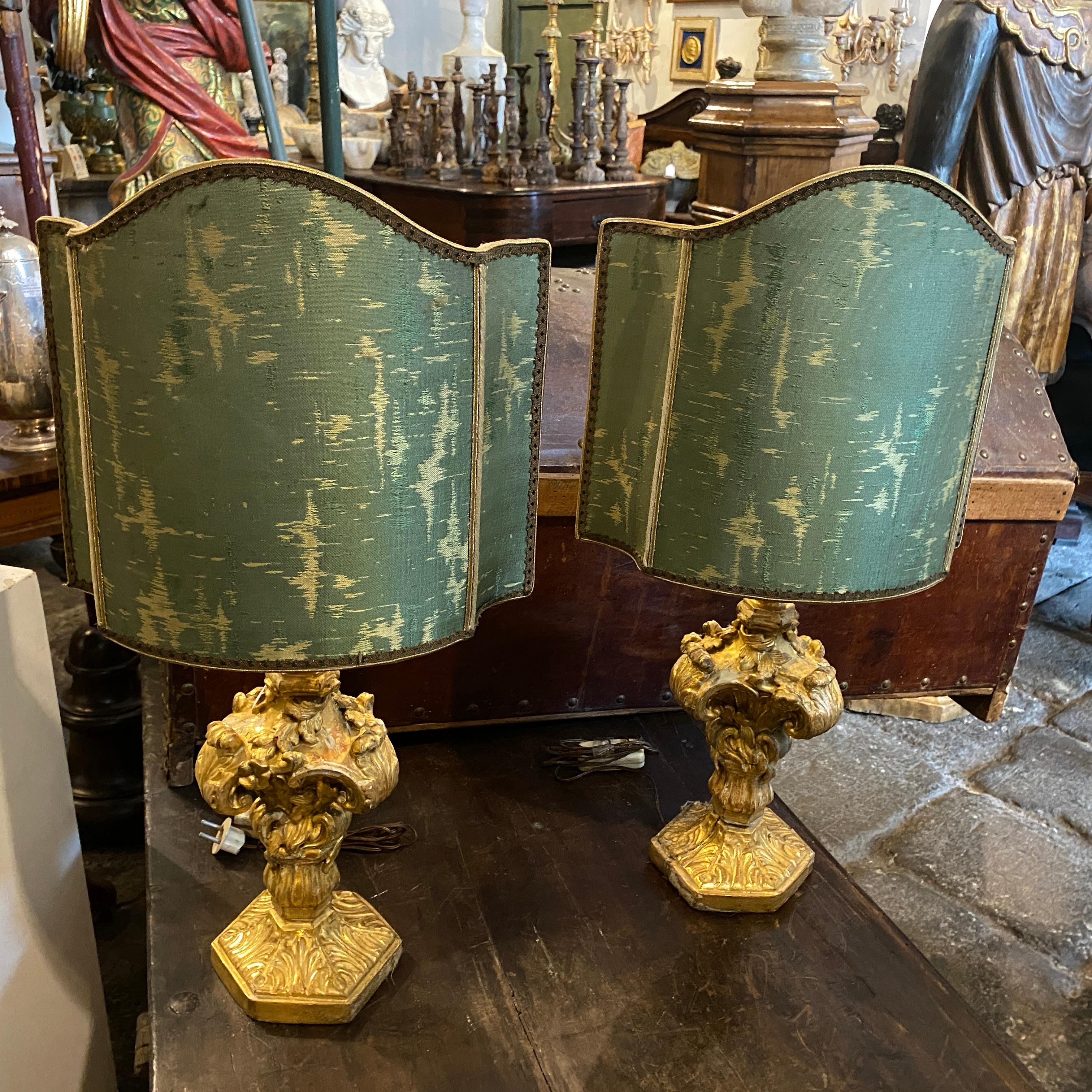 Two authentic Louis XV Sicilian palm holders, totally hand-carved and gilded wood it's in original patina, in early 20th century they have been transformed in bed lamps, they have original lampshades but they can easily return to their original