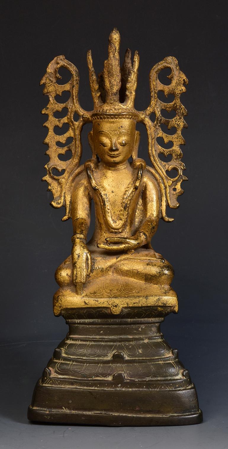 Burmese bronze seated crowned Buddha, or sometimes known as 'King Buddha', wearing diadem-crowns and ornaments of kings instead of ordinary monk's robes, with gilded gold.

Age: Burma, Shan Period, 18th century
Size: Height 24.6 C.M. / width 11